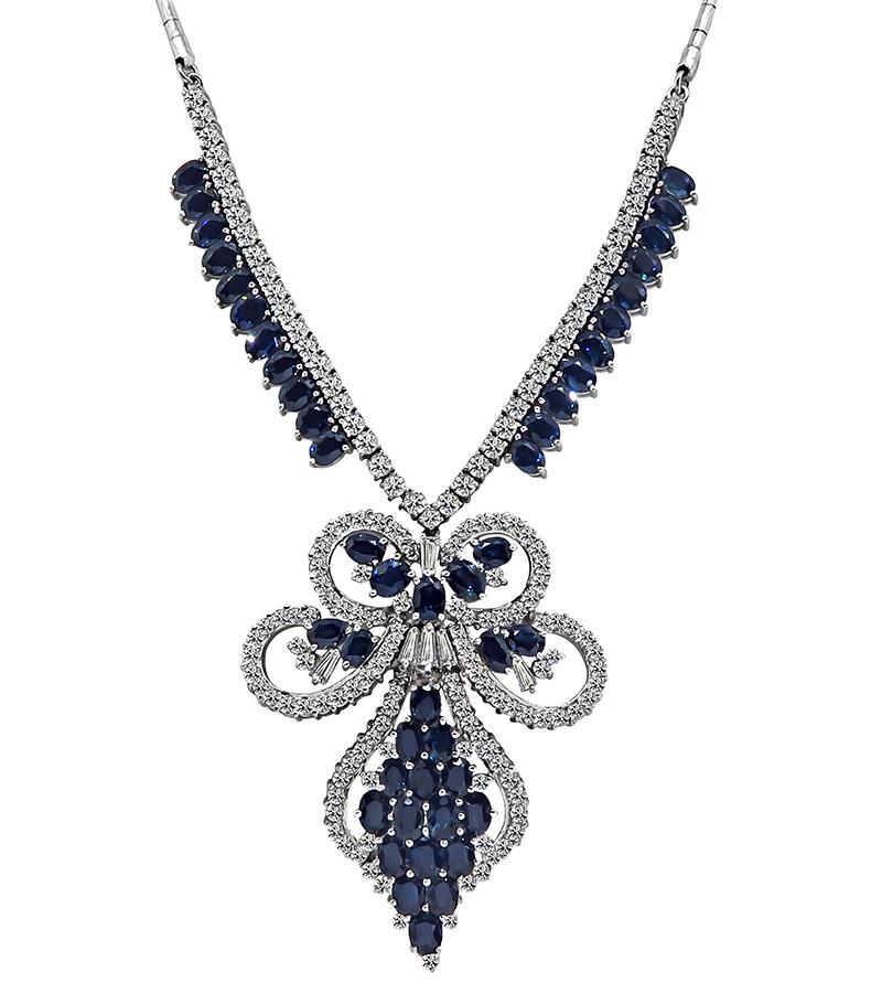 This is an amazing 14k white gold necklace. The necklace is set with sparkling round cut diamonds that weigh approximately 8.30ct. The color of these diamonds is H with VS clarity. The diamonds are accentuated by lovely oval cut sapphires that weigh