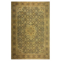 Alfombra Tabriz antigua de lana tejida de color azul marino, con motivos arabescos por toda la superficie y medallones, de la década de 1880