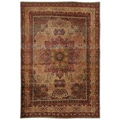 Tappeto antico persiano in lana rossa Kerman del 1880 fatto a mano con motivo a rosette