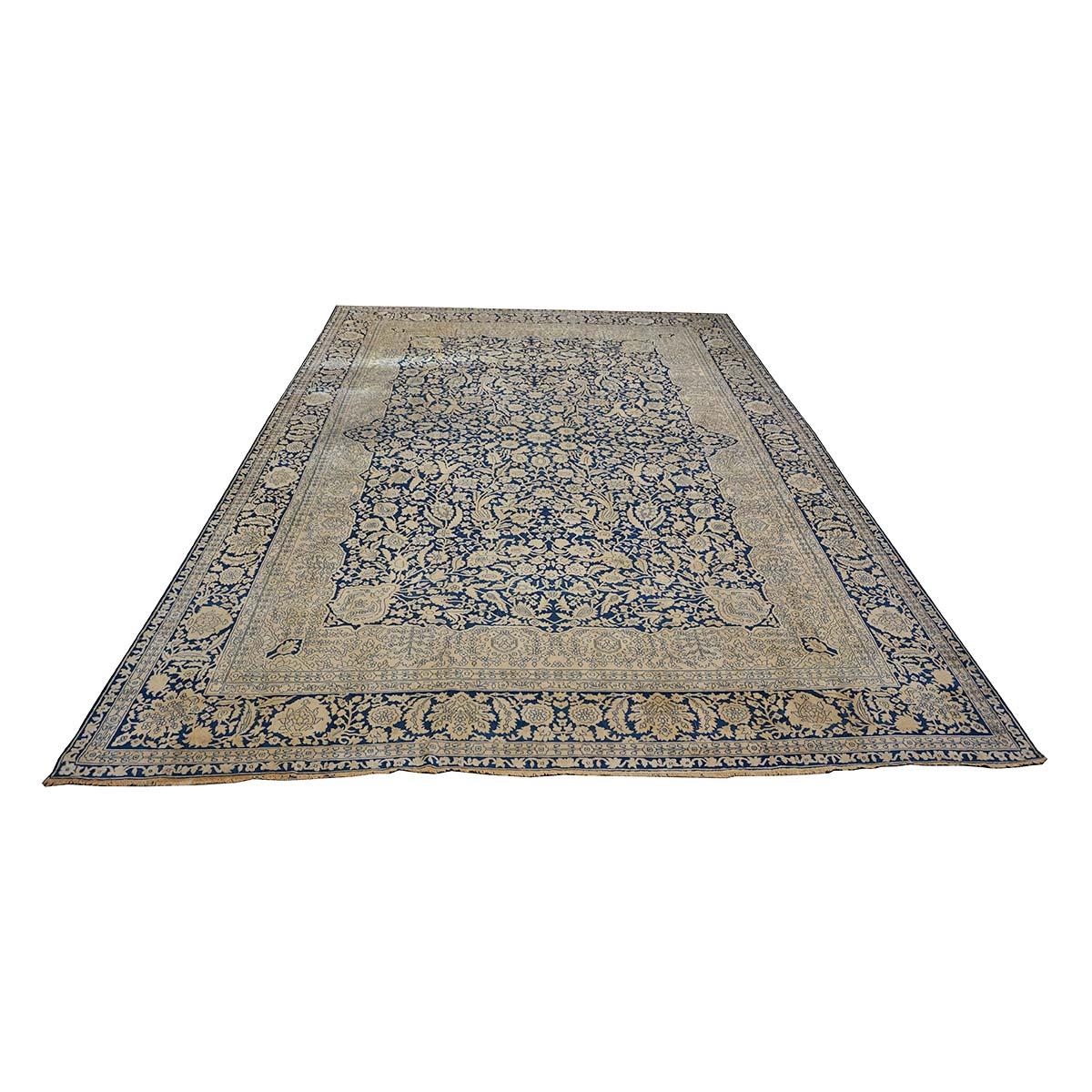  Ashly Fine Rugs presents an exquisite 1880s Antique Persian Mohtasham Kashan roughly 9x12 woven with an indigo blue background and tan borders. This is an example of a well-preserved extremely fine Kashan made of Kork Manchester wool and all four