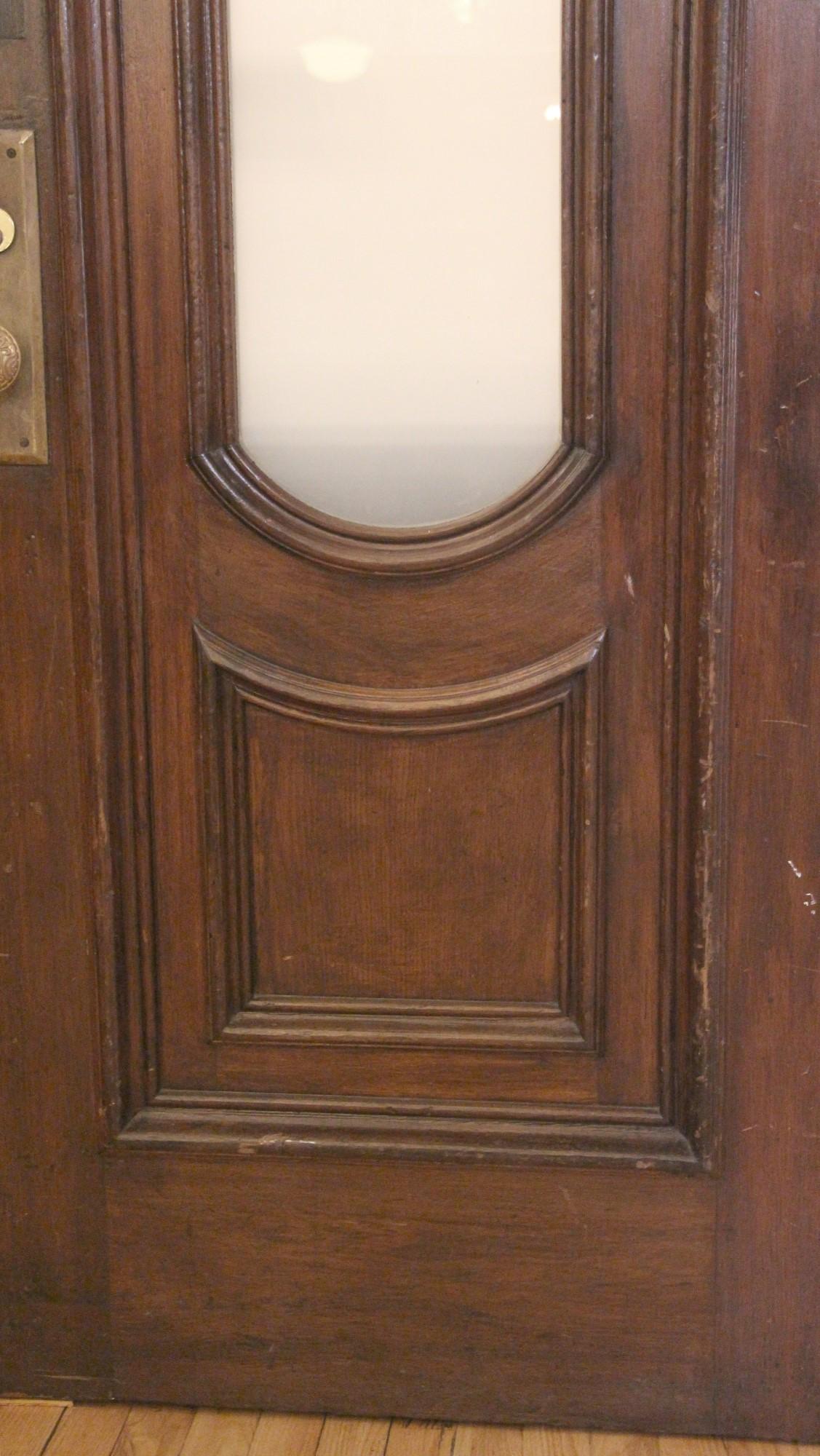 Late 19th Century 1880s Arched Walnut Brownstone Entry Double Doors with Frosted Glass & Hardware