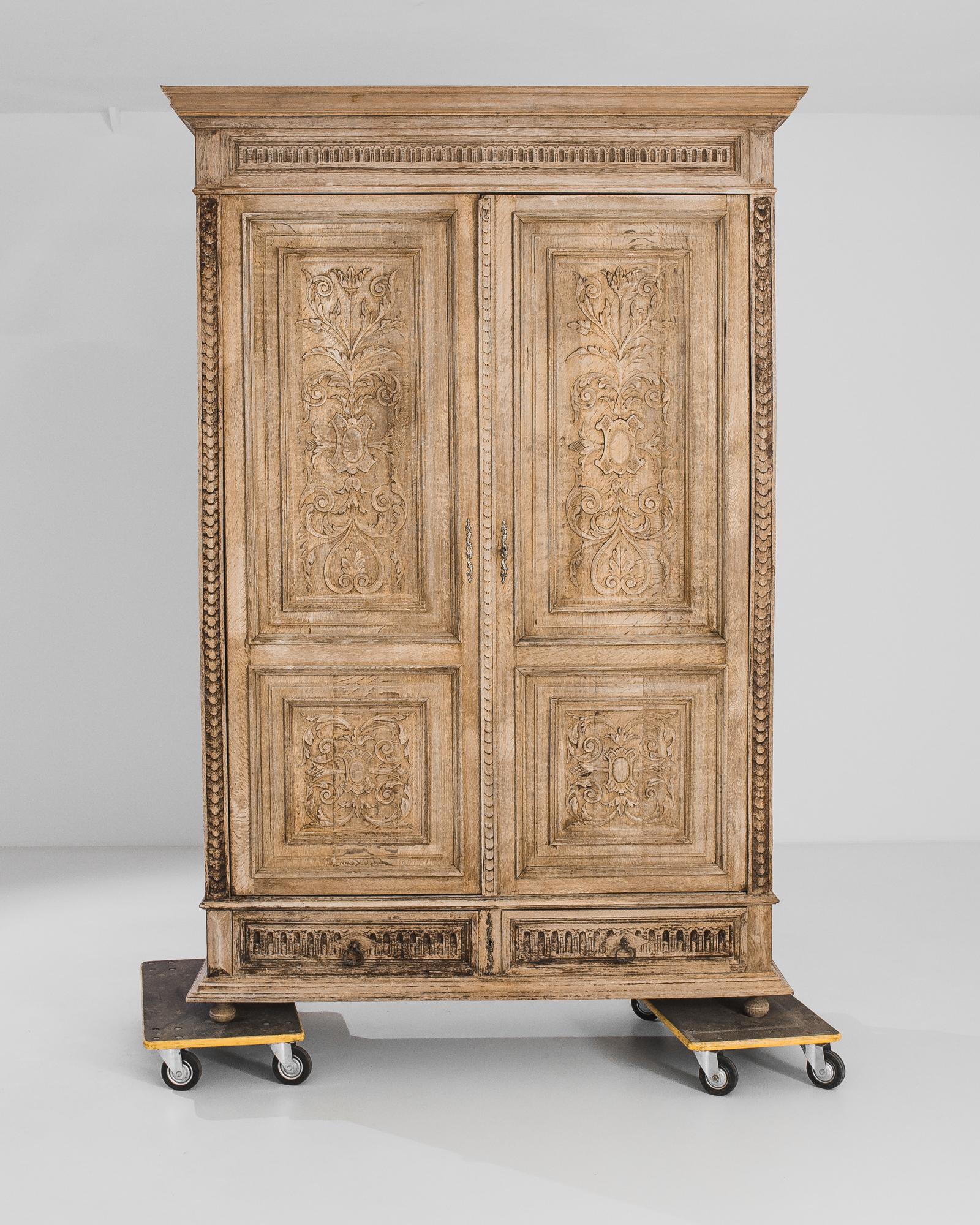 Stepping into the refined interiors of late 19th-century Belgium, this bleached oak armoire from the 1880s stands as a testament to the elegance and craftsmanship of the era. Crafted with meticulous attention to detail, this piece embodies the