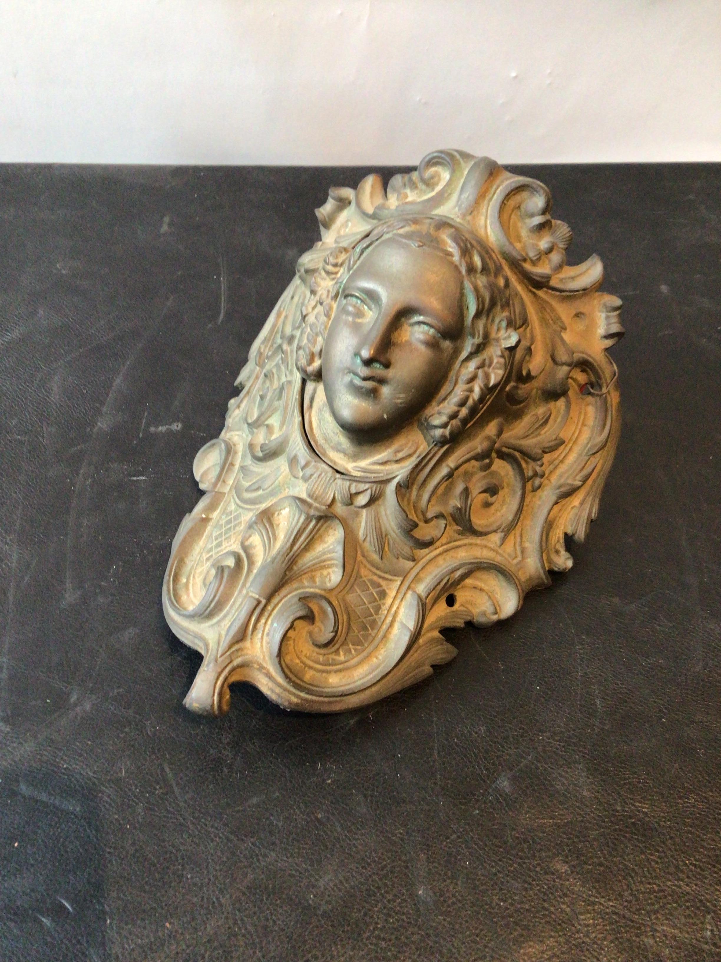 1880s decorative bronze piece. Woman’s head flips up. I’m not sure what this originally was. When I bought it, it was hung in the library of a Southampton, NY estate.