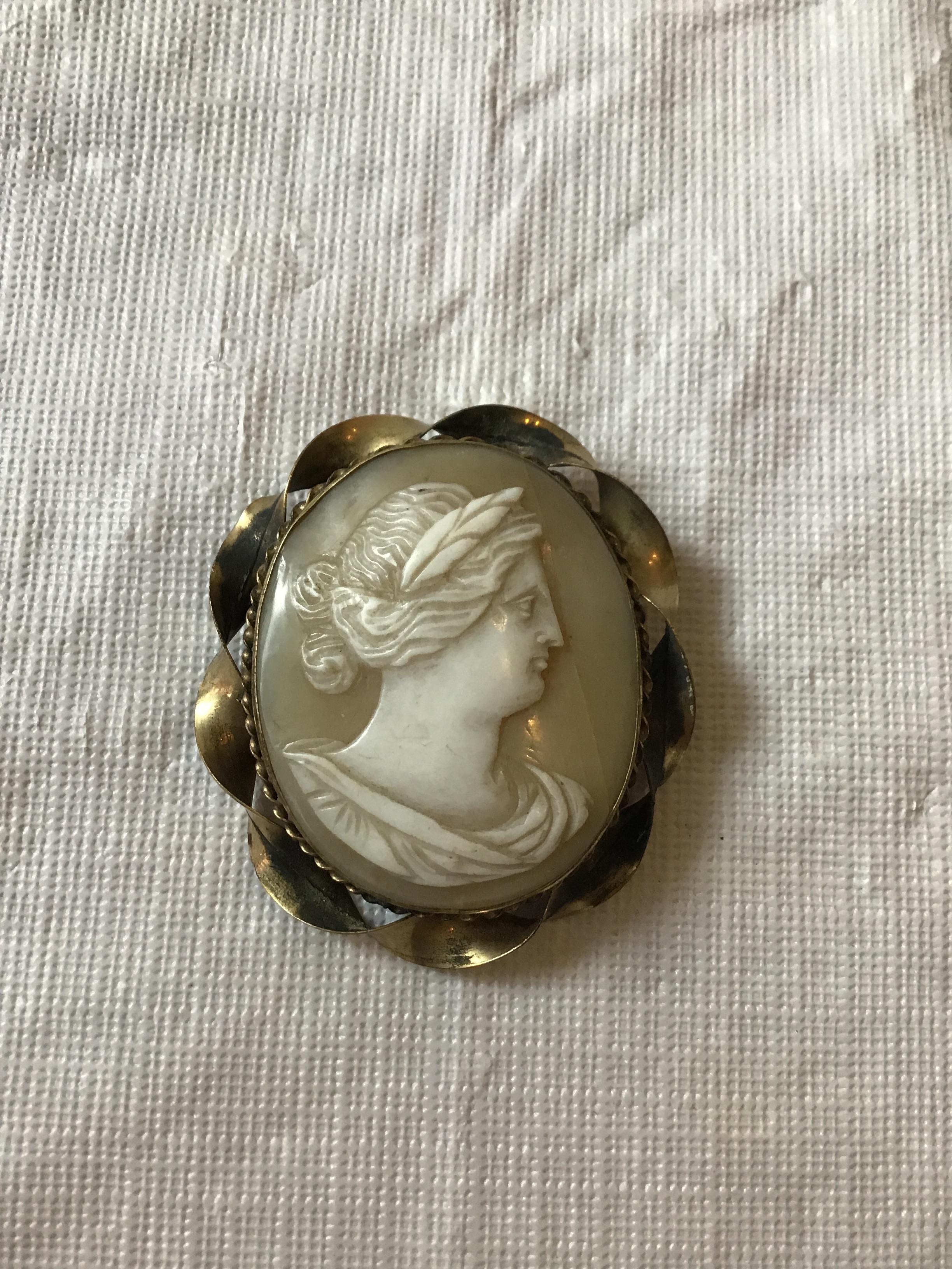 1880s carved out of shell, cameo. Brass casing.