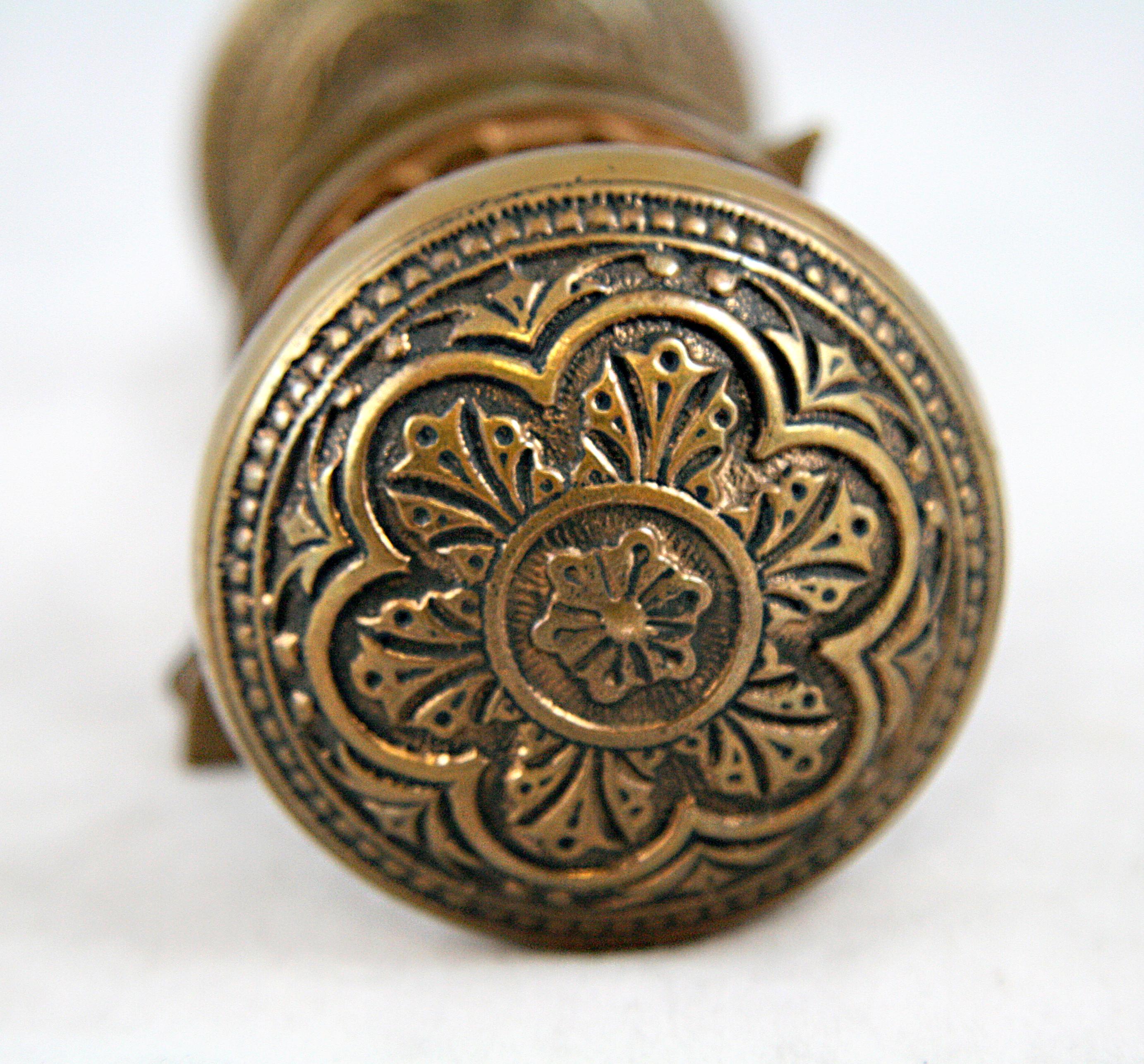Manufactured by P.&F. Corbin Company Hardware in 1880. Part of the J-2010 style group. This set consists of two 6 fold ornate bronze door knobs, two rosettes, one keyhole escutcheon, and a spindle. Small quantity available at time of posting. Priced
