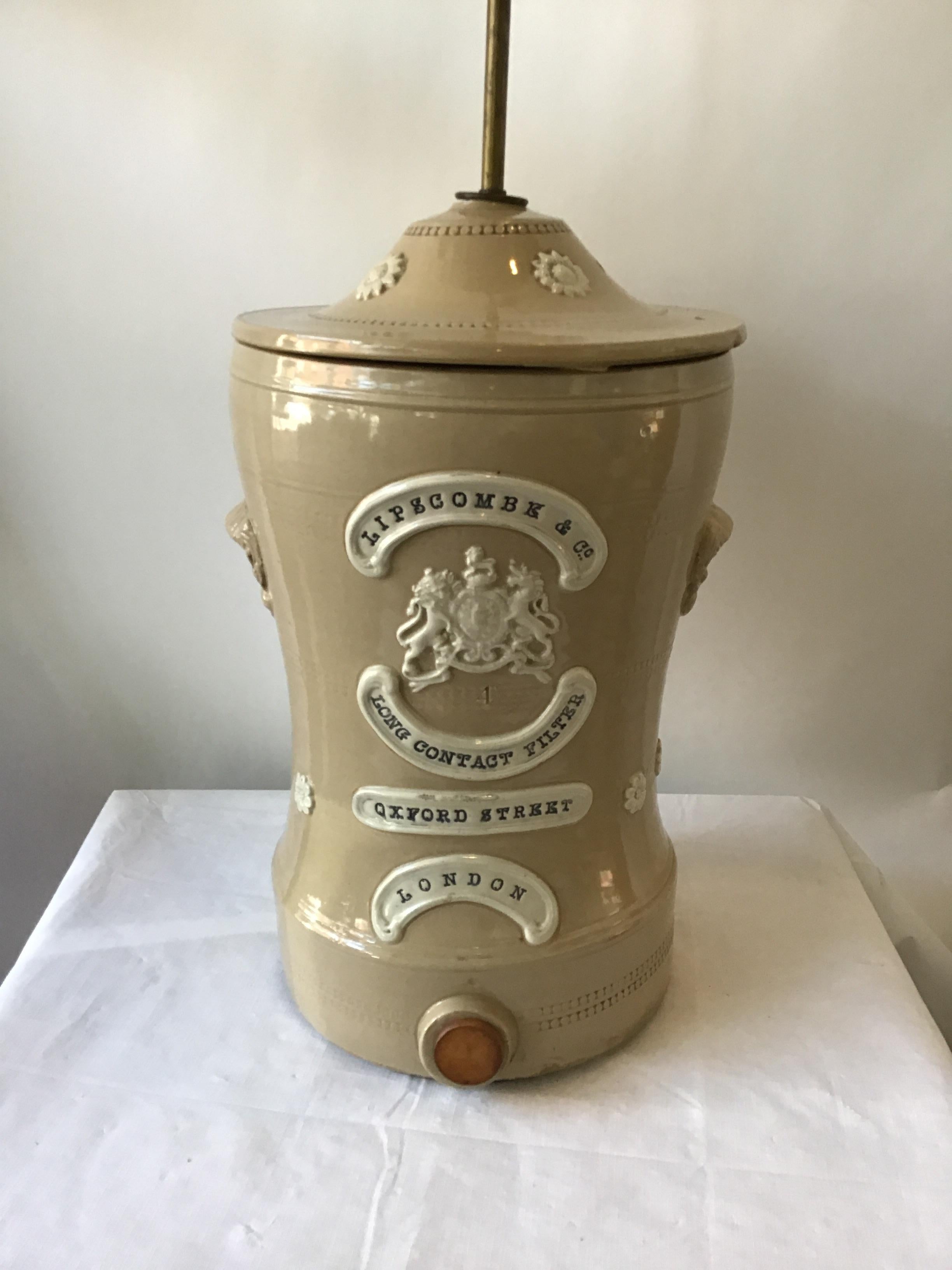 1880s English stoneware water filter turned into a lamp. These filters were used to soften hard water. Made by Lipscombe and Co. in London.