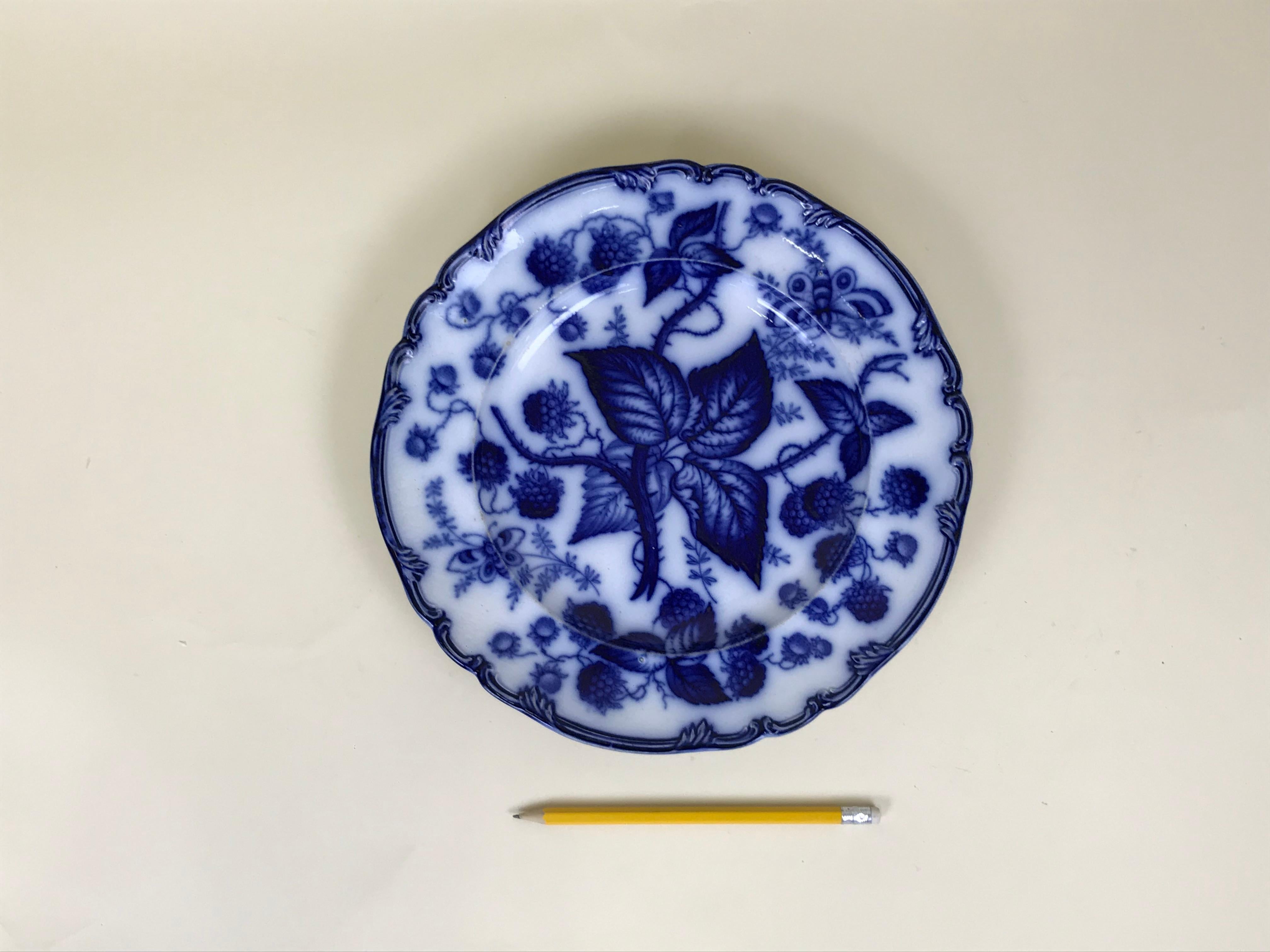 Earthenware dinner plate, made in Staffordshire in circa 1880.
Printed with flow blue naturalistic pattern of berries and butterfly. In excellent condition; no chips, cracks, restoration or signs of wear. Marked upper case BERRY.