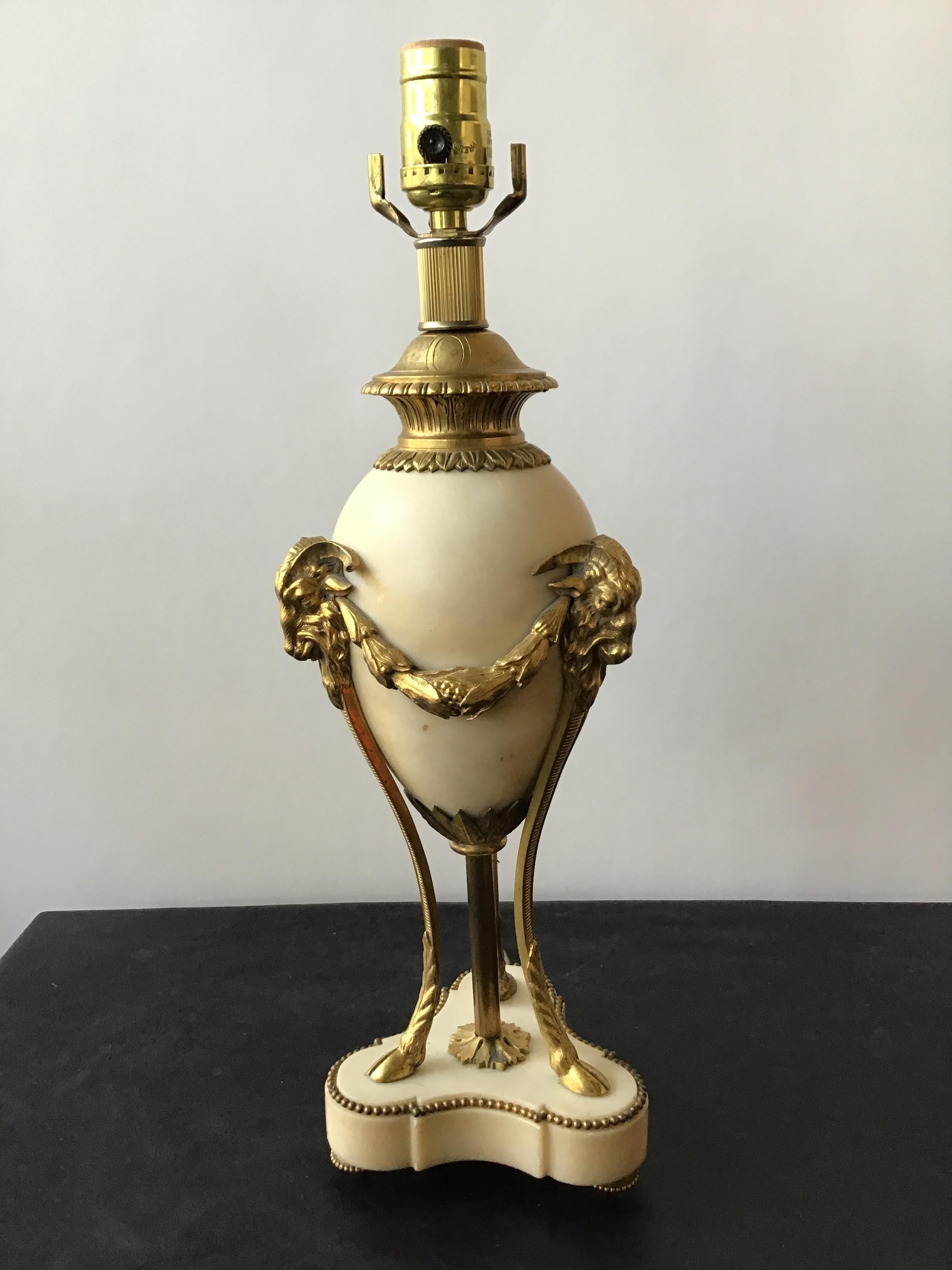 1880s French classical bronze and marble ram table lamp.