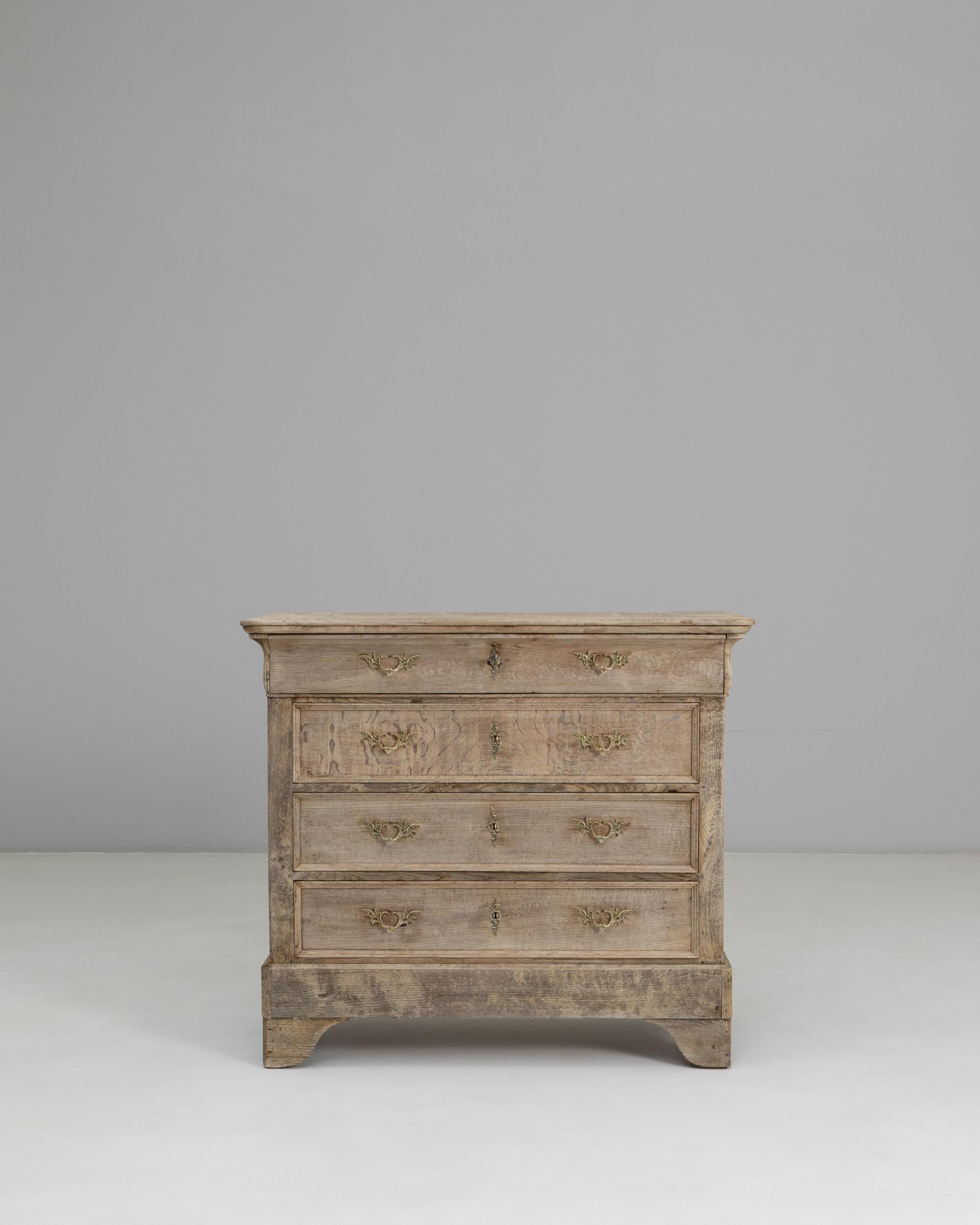 1880s French Gustavian Chest of Drawers. This elegant 19th-century chest reflects the refined simplicity of the Gustavian aesthetic, characterized by clean lines, balanced proportions, and a soft, muted patina. Crafted in France from solid oak, it
