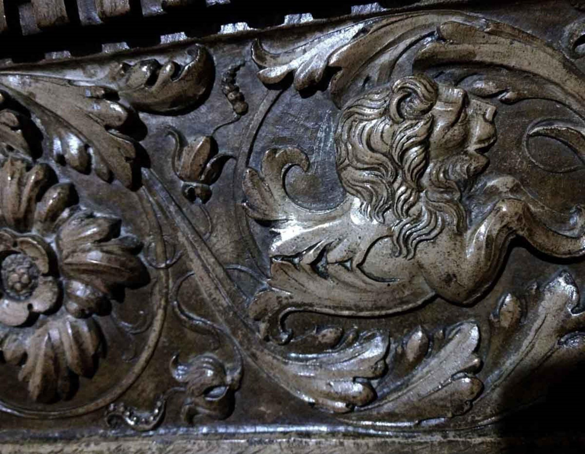 This is a late 1800s large scale carved, stained, and lacquered French limestone mantel. It was reclaimed from a prominent private residence on the upper West side of Manhattan. Floral patterns, lions, centaur type figures, and a unique helmeted