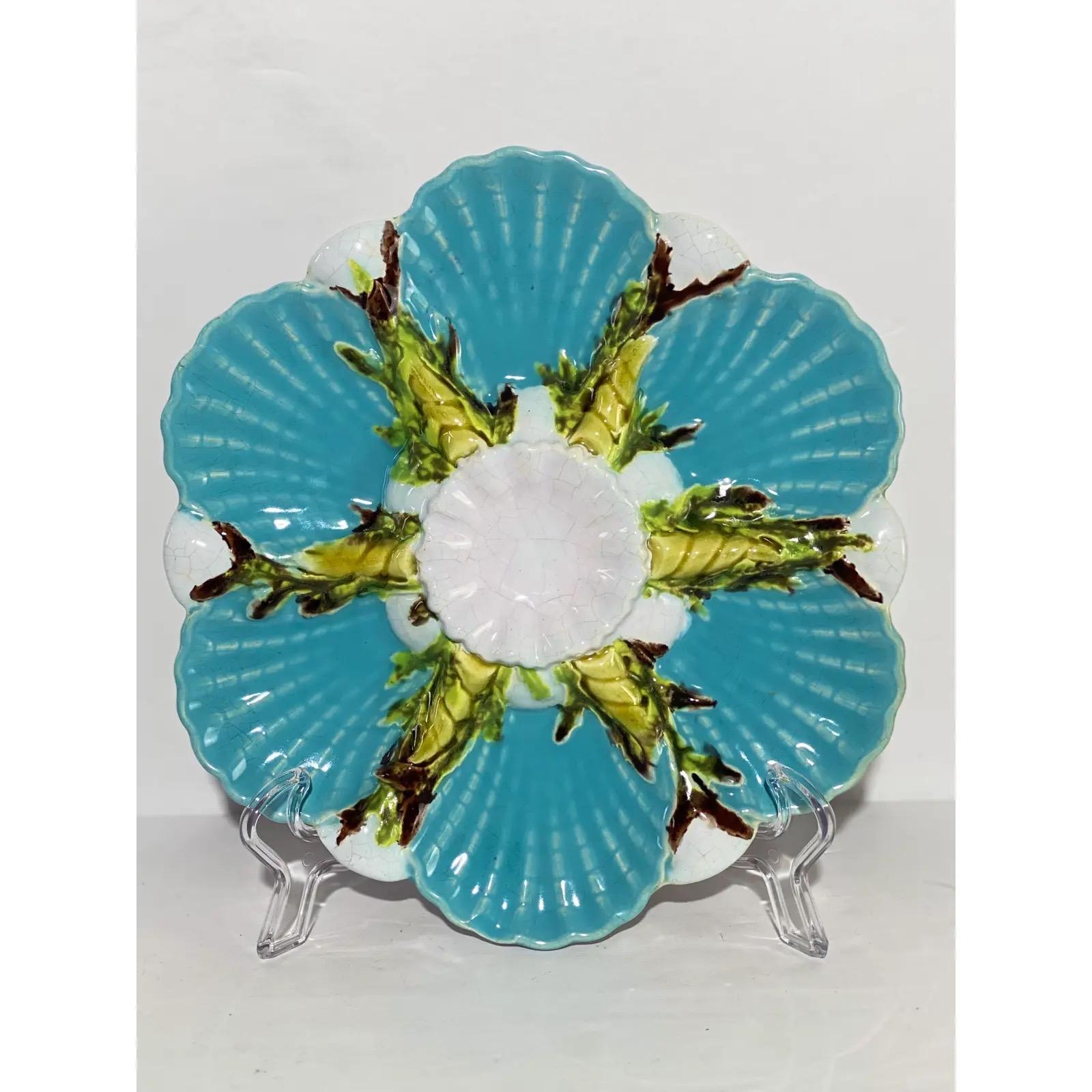 We are very pleased to offer a beautiful collector’s piece, a George Jones Majolica Oyster Plate, circa the late 1800s. George Jones is one of the most coveted names in majolica. In 1886, the majolica maker brought his sons into the pottery