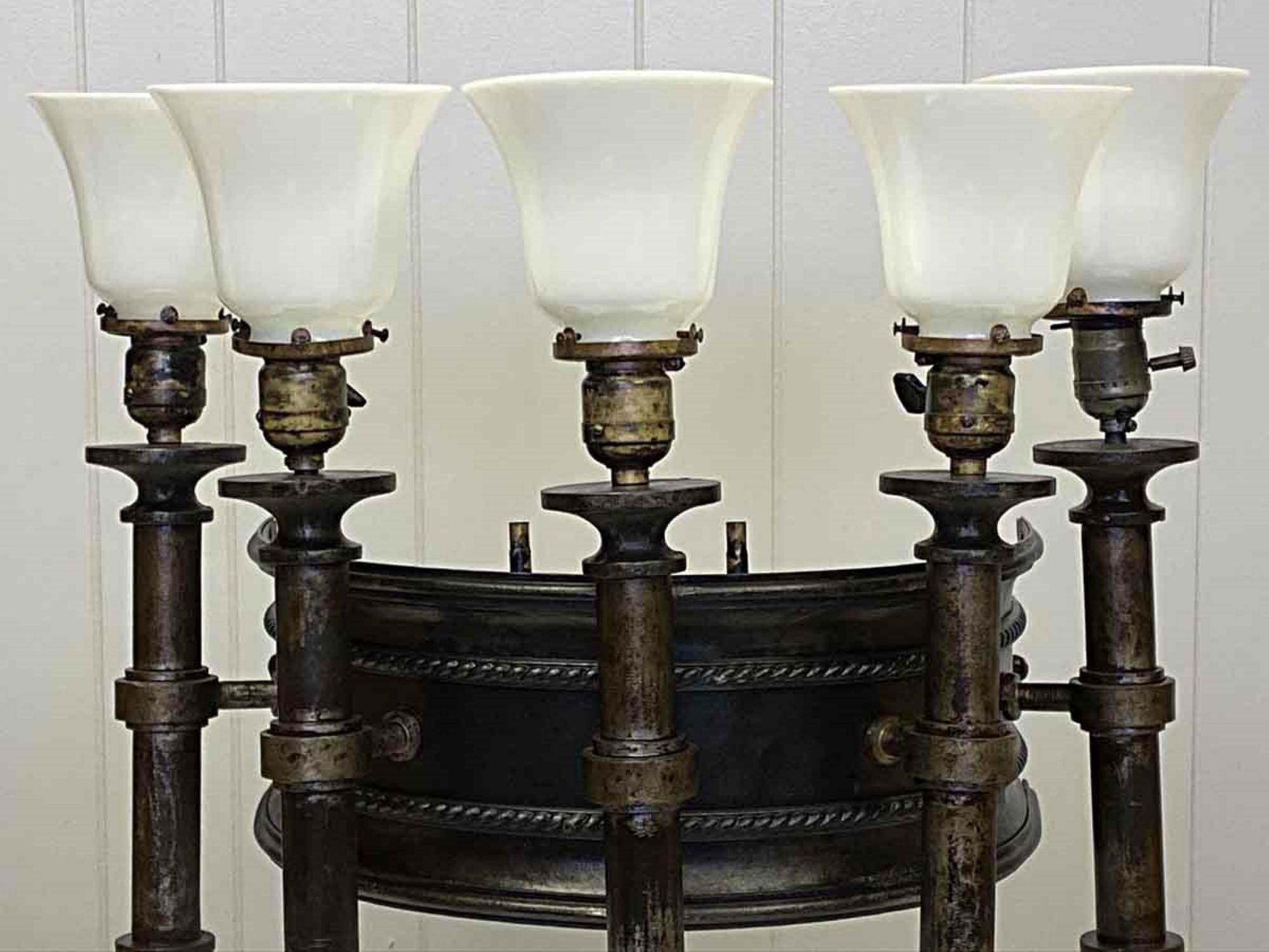 1880s majestic electrified Gothic gas sconce.. Cast iron and steel featuring five lights with new white glass shades. Cleaned and rewired. Small quantity available at time of posting. Priced each. Please inquire. Please note, this item is located in