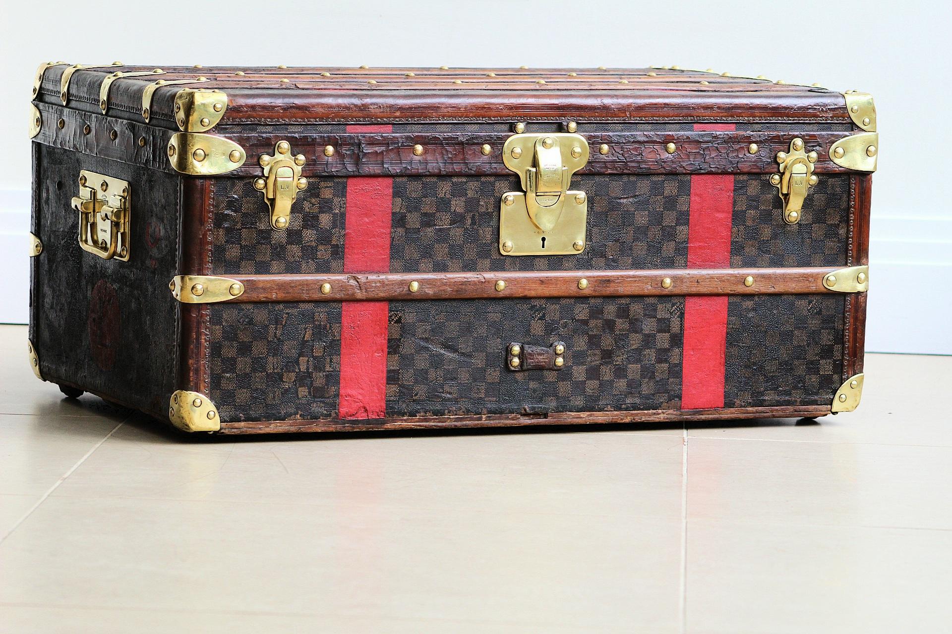 Immerse yourself in the allure of timeless luxury with this magnificent Louis Vuitton Cabin Trunk, a storied piece from the 1880s that radiates the elegance and adventure of a bygone era. This exquisite trunk, crafted during the golden age of