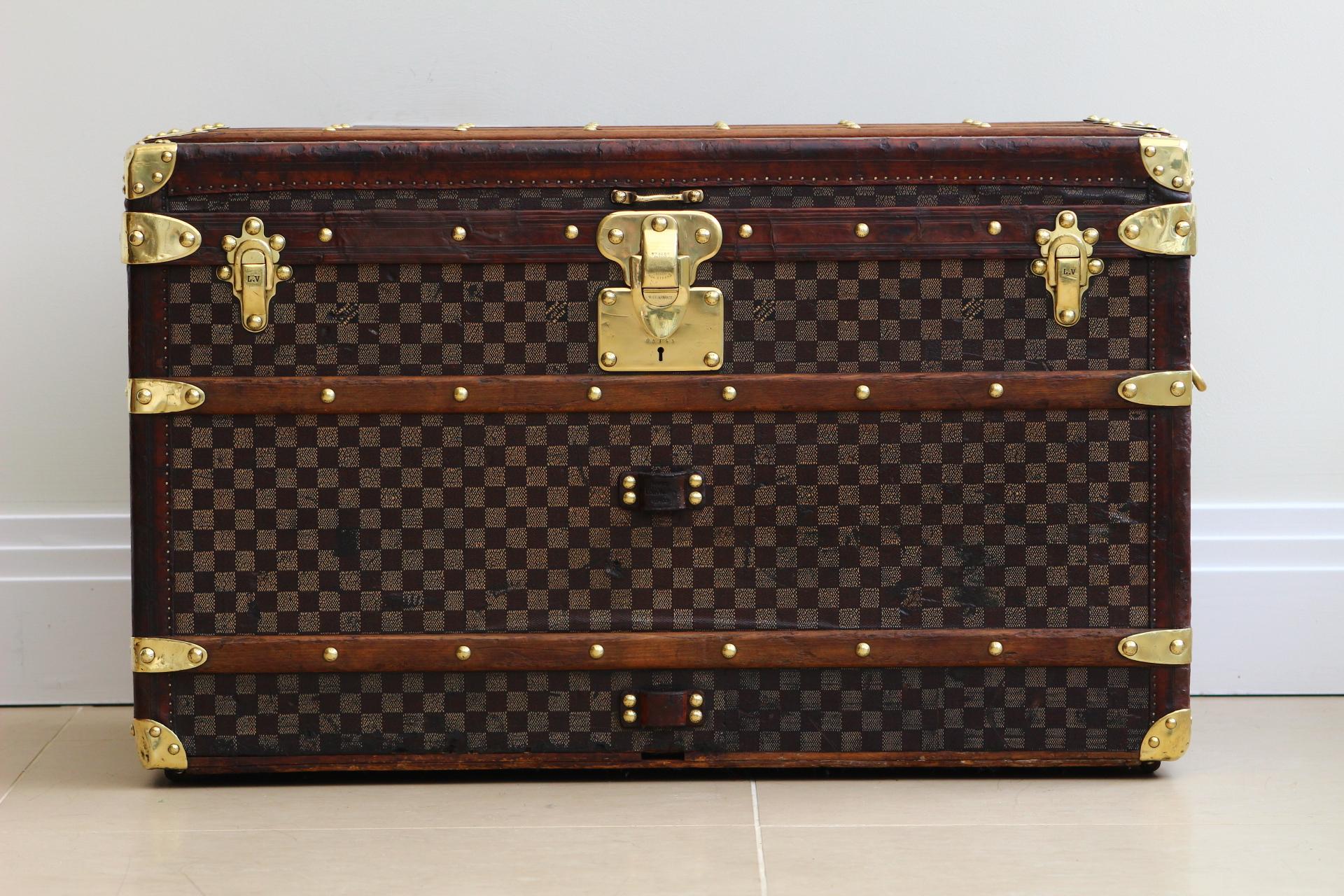 Louis Vuitton Courier Trunk, a testament to the lavish journey of luxury travel dating back to the 1880s. This exceptional piece is meticulously crafted in the iconic Damier canvas, a hallmark of Louis Vuitton's enduring style and elegance. The