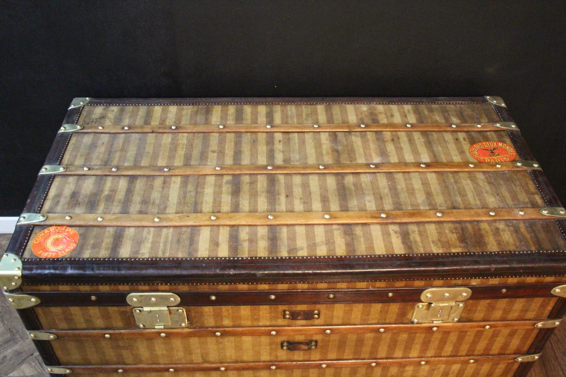 This Louis Vuitton steamer trunk, circa 1880s, features the sought after striped 