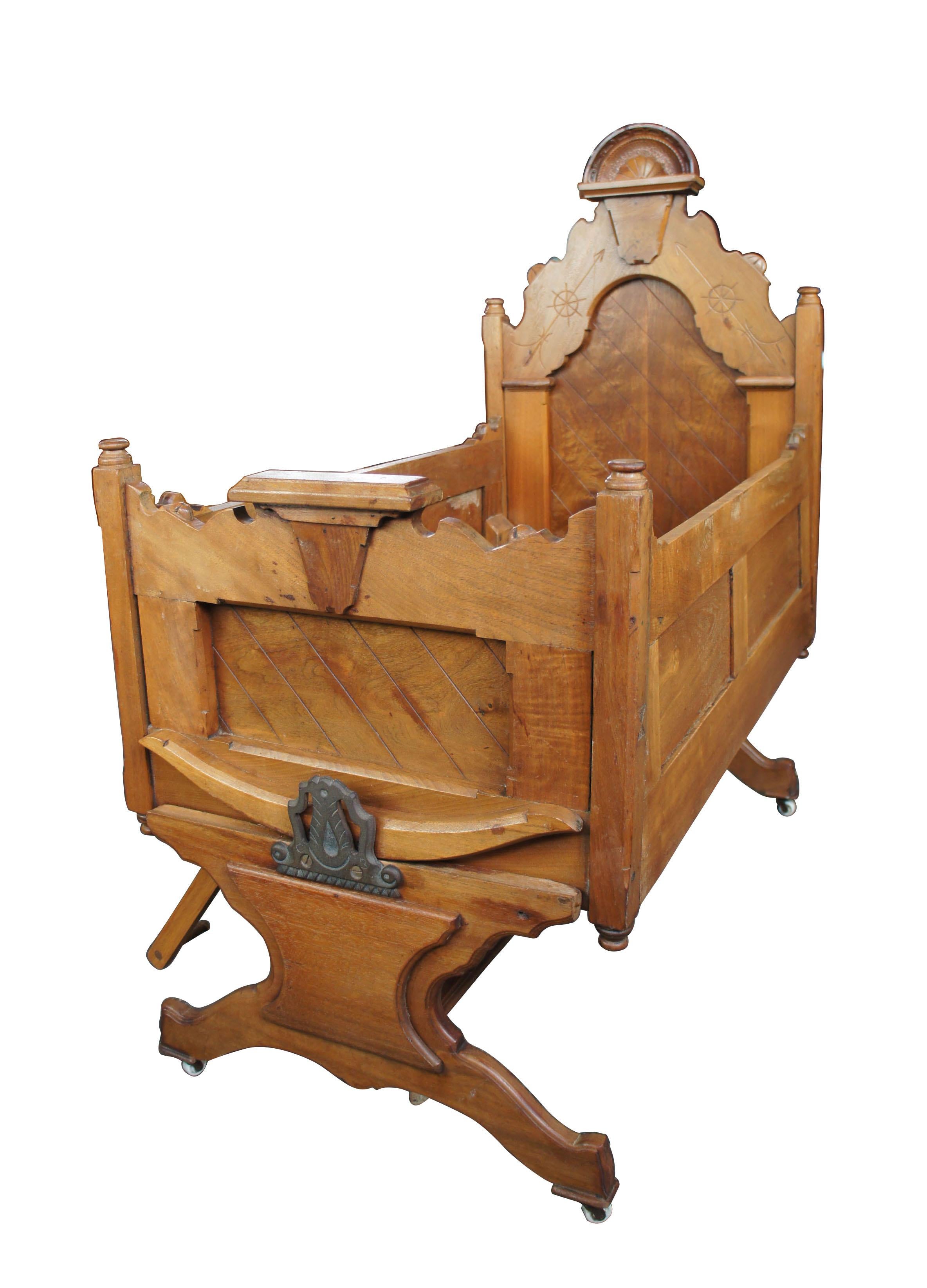 1880s ornate Victorian rocking cradle carved walnut knockdown rocker baby bed

A gorgeous Victorian era cradle,circa 1880s. Made from carved walnut with a knockdown design allowing it to be moved and assembled easily. Along the left side is a foot