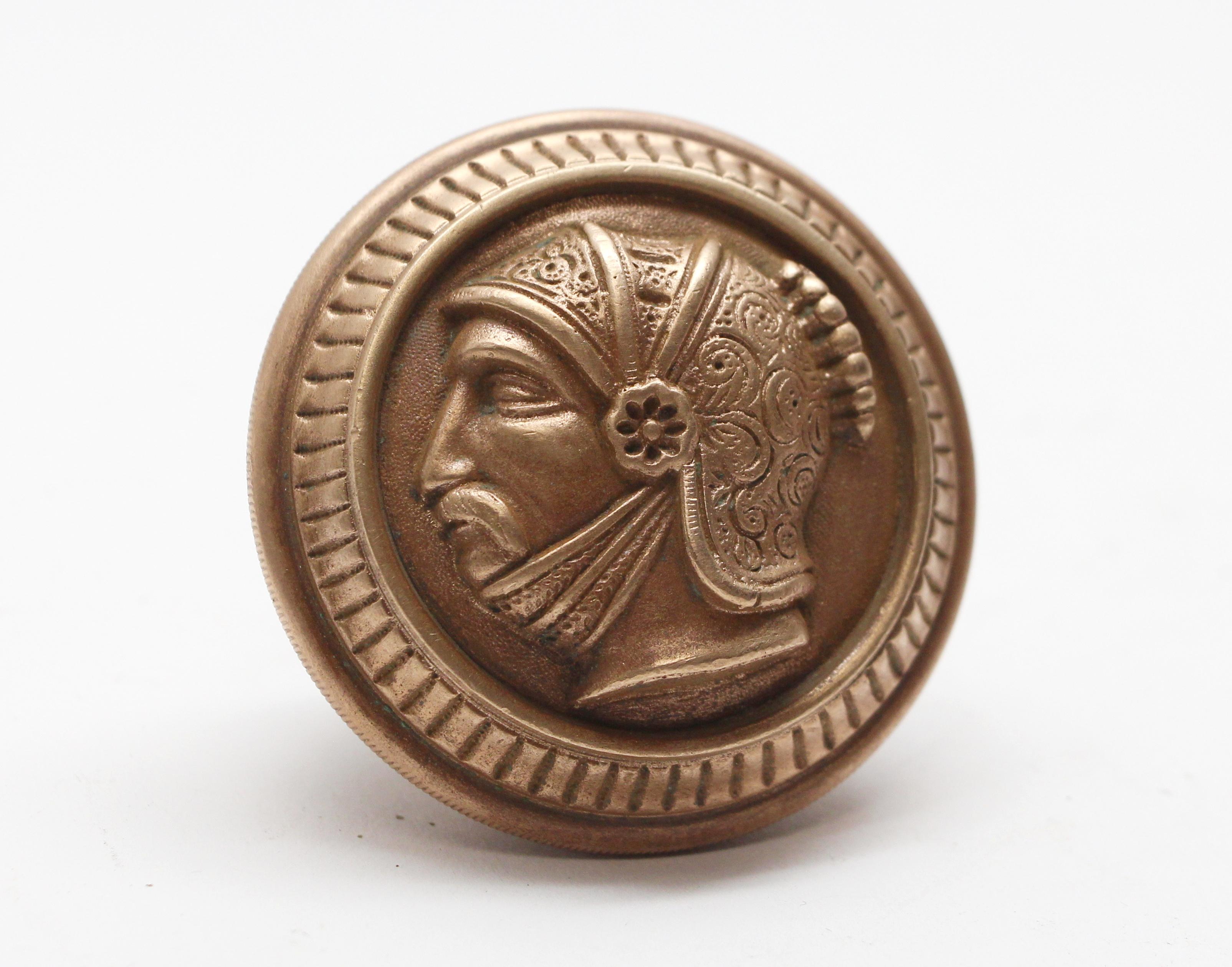 This representational style bronze knob was made in 1880. It is part of the A-31120 Greek Head group. One available. This can be seen at our 400 Gilligan St location in Scranton, PA.