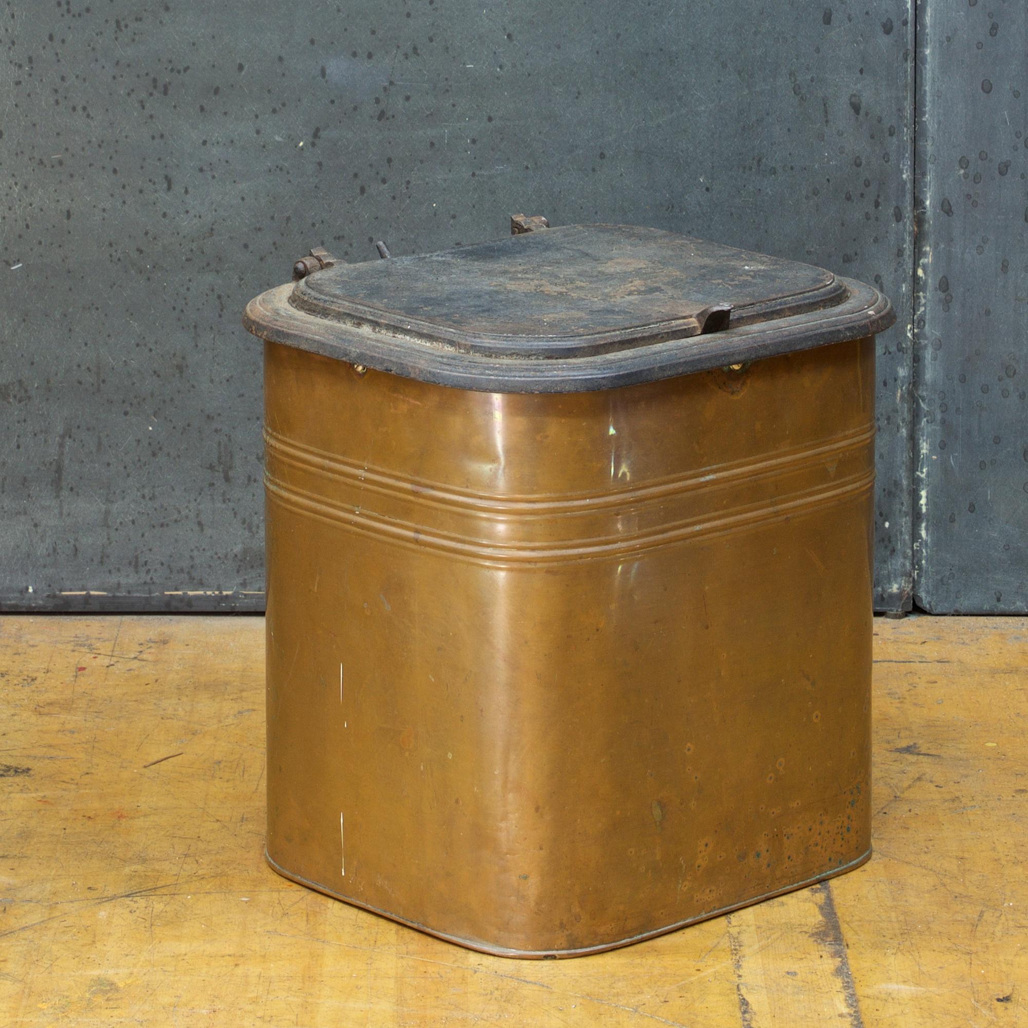 New York USA, circa 1880s.
Rochester Stamping Works. A scarce copper and cast iron lidded coal or ash bin, having a cast iron hinged lid and rim over a copper body. The interior lid stamped 