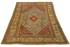 1880s Turkish Oushak Antique Wool Rug In Blue Featuring a Medallion Design