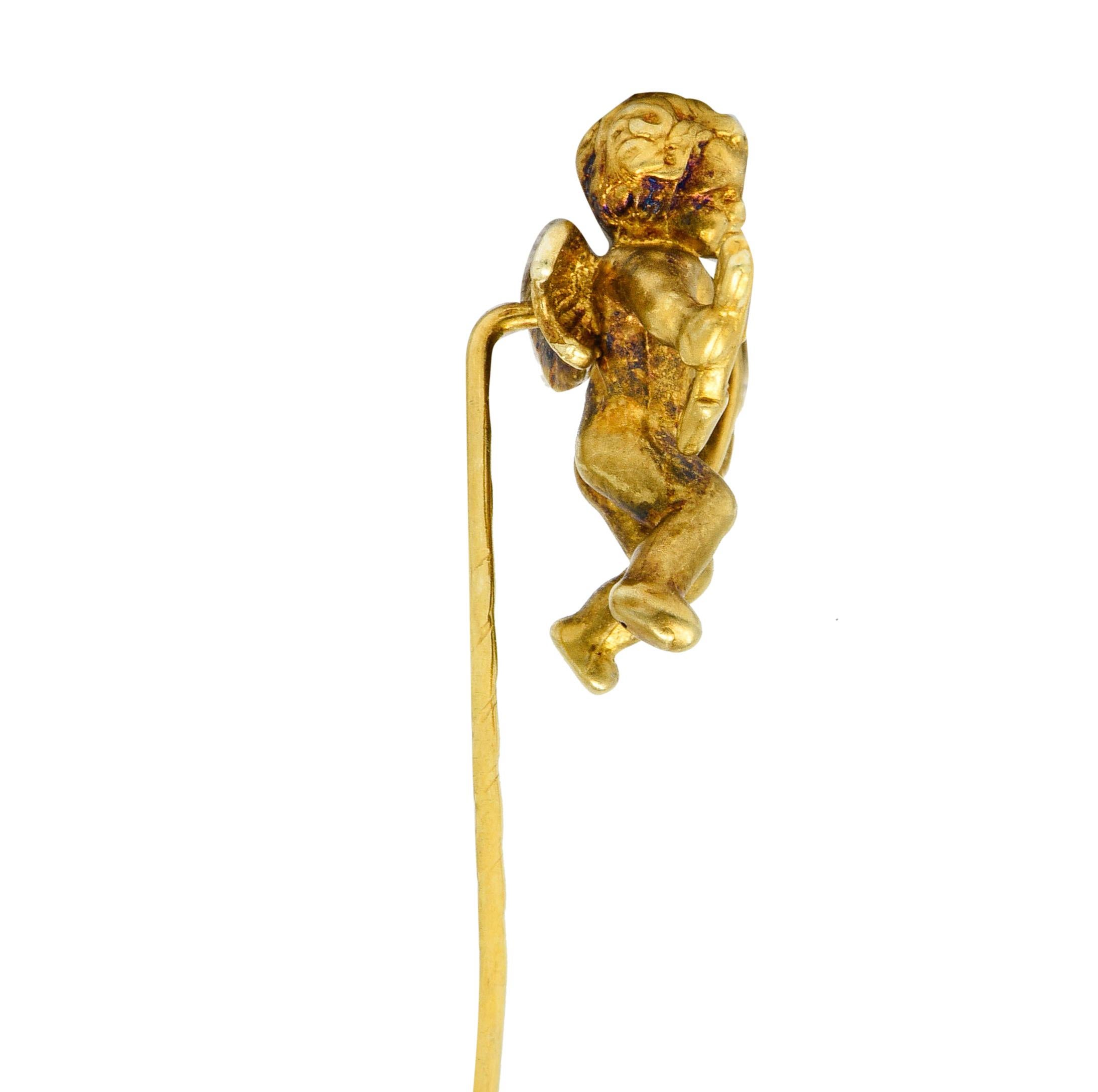 Designed as a highly rendered cherubic cupid

With dainty stylized wings while holding a bow and a single arrow

Maker's mark and stamped 14K for 14 karat gold

Circa: 1880’s

Cupid measures: 3/4 x 7/8 inch

Total length: 2 inches

Total weight: 1.7