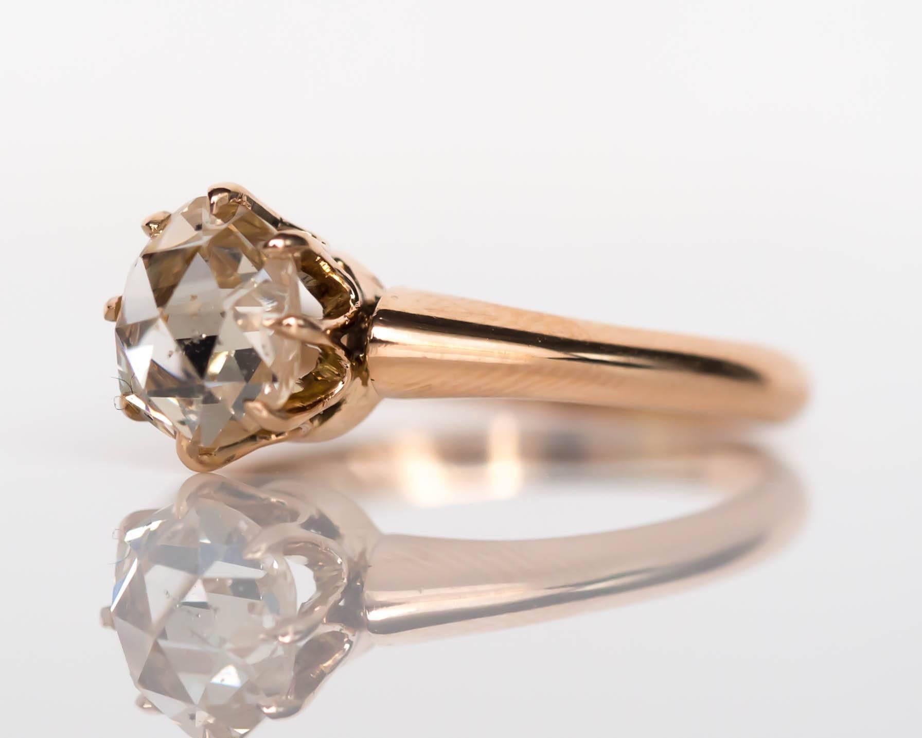 Item Details: 
Ring Size: 6.25
Metal Type: 9 Karat Yellow Gold
Weight: 2.5 grams

Center Diamond Details:
Shape: Rose Cut
Carat Weight: .83 carat
Color: L
Clarity: I1

Finger to Top of Stone Measurement: 7.39mm

The inner shank is engraved 