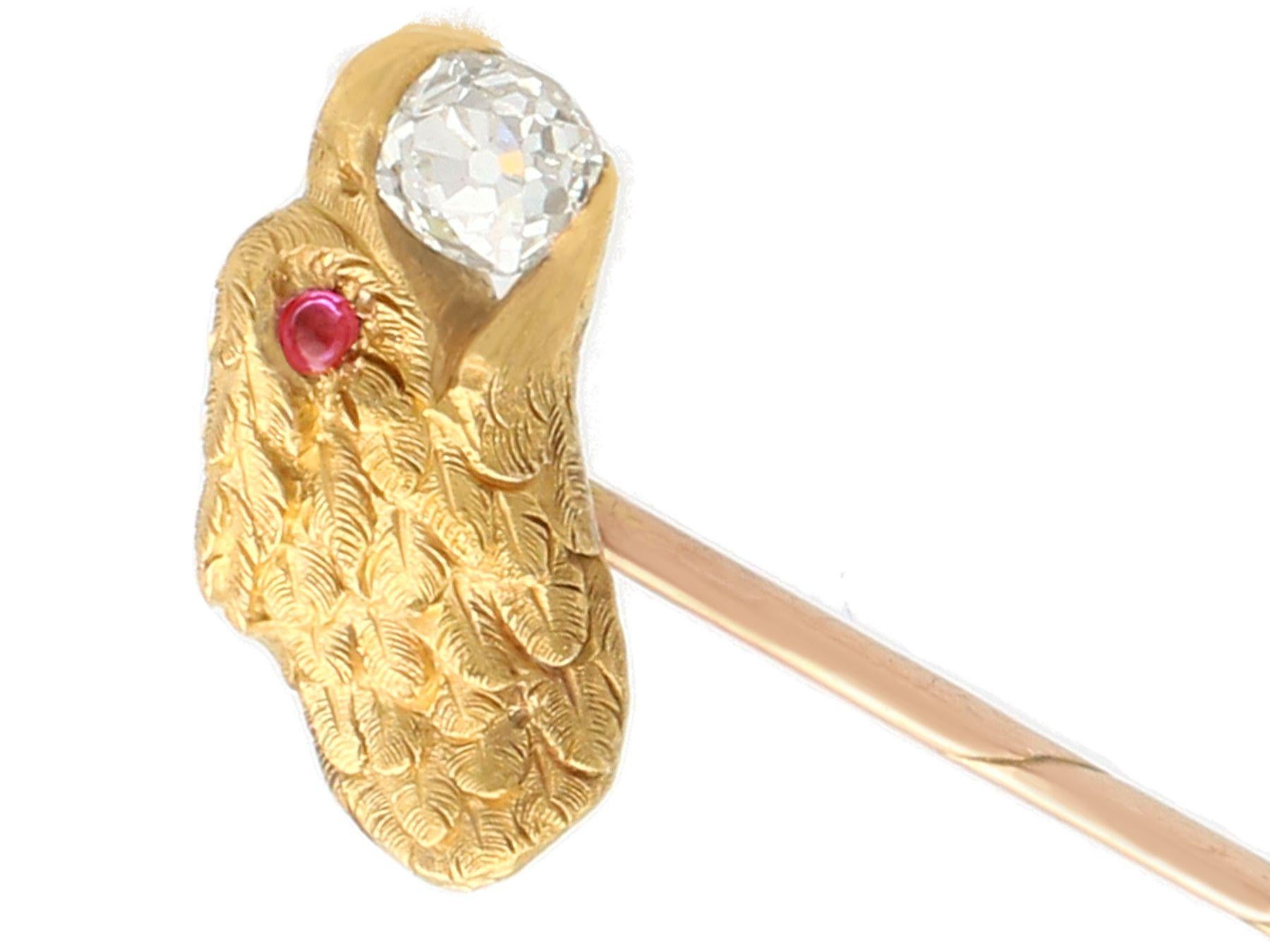 A fine and impressive 0.34 Ct diamond and 0.04 Ct ruby brooch in 21k and 14k yellow gold; part of our antique jewelry and estate jewelry collections.

This fine and impressive Victorian brooch has been crafted in 21k yellow gold with a 14k yellow