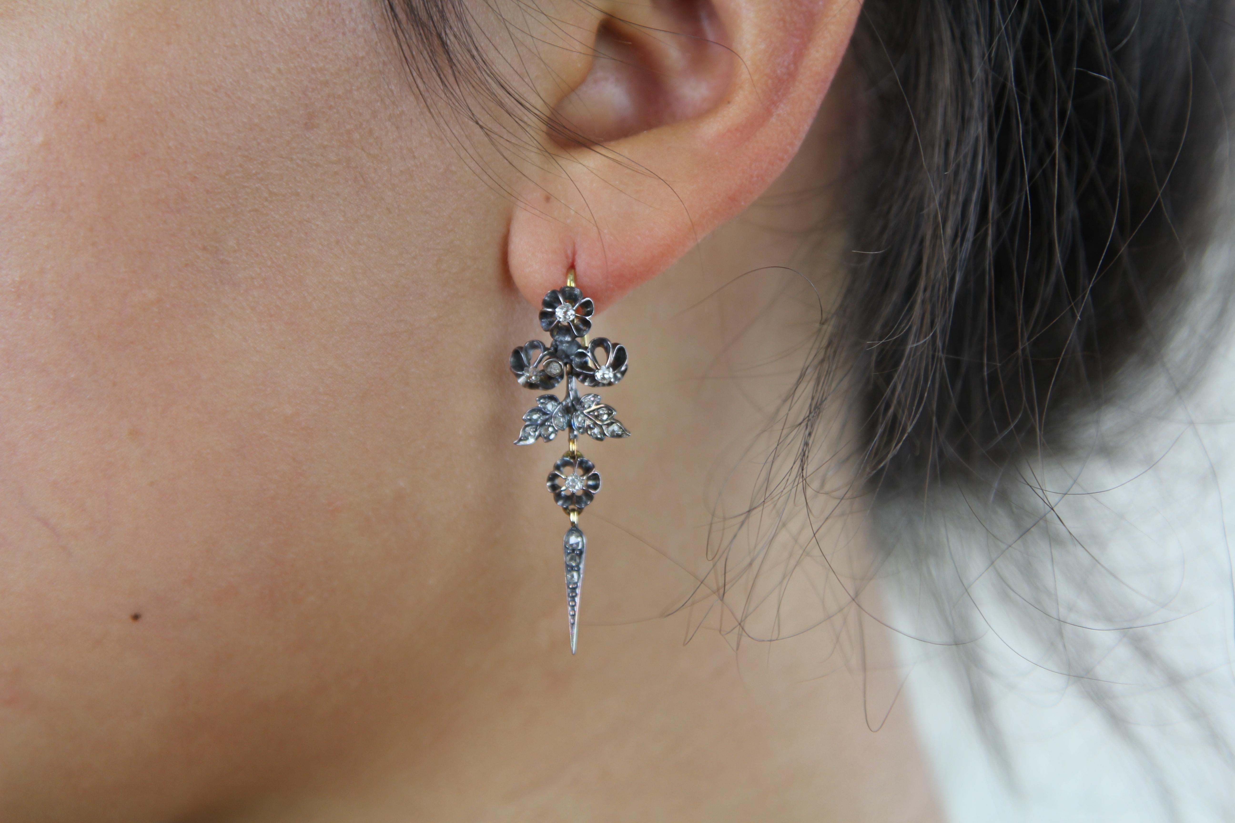 A unique pair of Victorian diamond drop earrings set in silver on gold and composed entirely of original old-mine-cut diamonds and rose-cut diamonds, all in excellent condition. Approximate total diamond weight 0.50 ct, H/I colour and range in