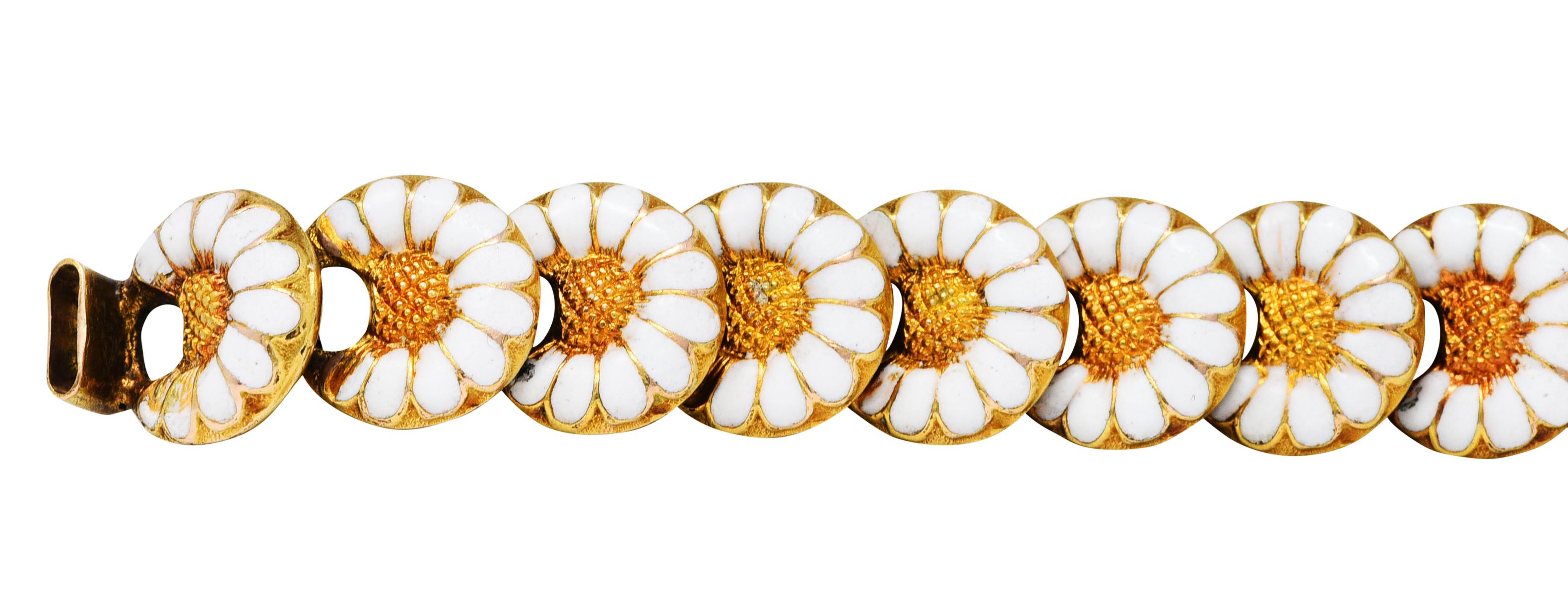 Bracelet is comprised of puffed circular links designed as daisy motifs

With texturous centers and petals glossed with opaque white enamel - some loss

Completes as a unique hook and eye clasp that secures with a functioning heart padlock

With a