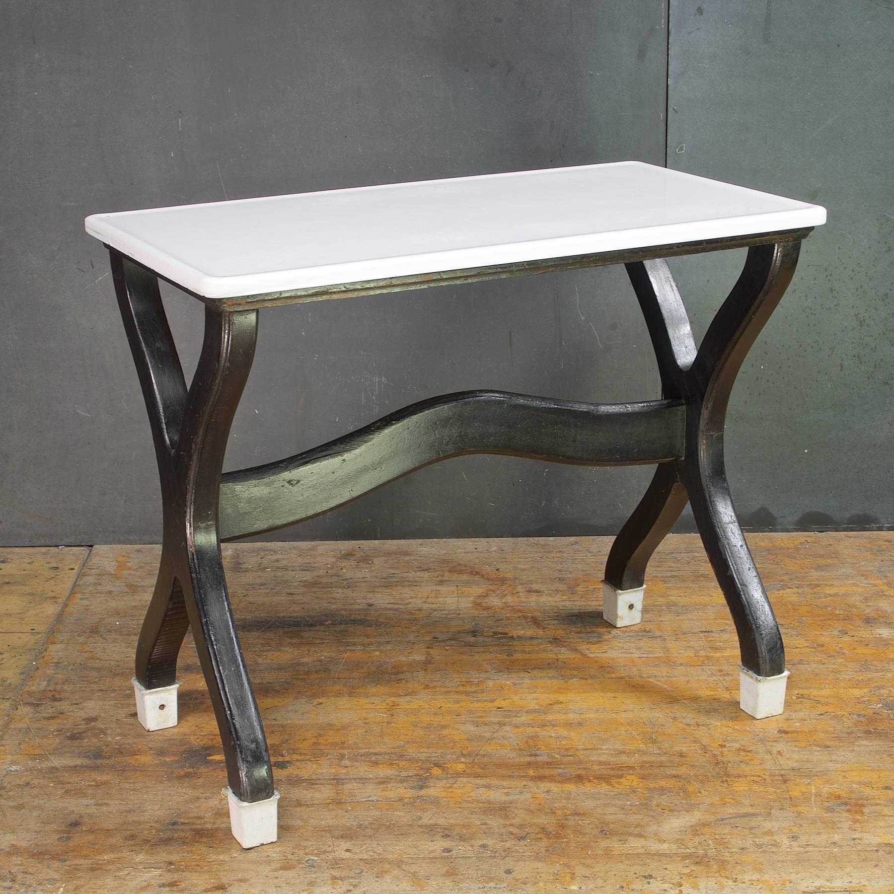 Beautiful opaque white surface. A historical and obsolete Industrial cooking relic with the original vitrolite (milk glass slab top).  Perhaps used as a Bakers' prepping desk worktable. H 30.38 in. x W 35.75 in. x D 20 in.
