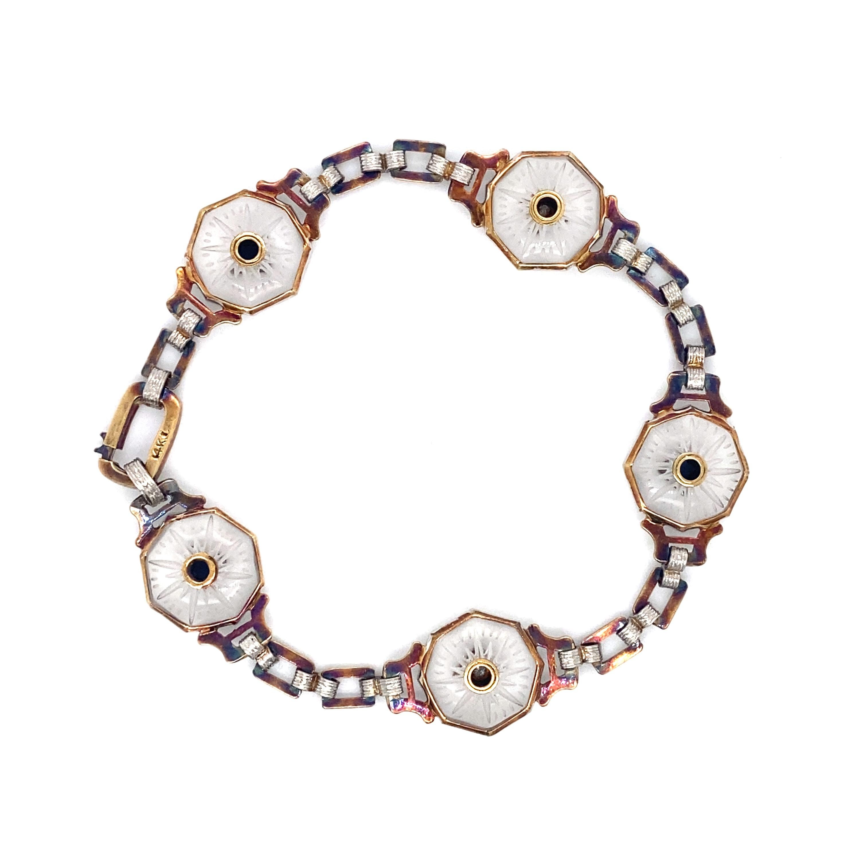 Item Details: This Victorian-era bracelet has links of bezel set rock crystal with alternating French cut sapphire and single cut diamond accents. This is a gorgeous piece with beautiful Victorian flair!

Circa: 1880s
Metal Type: 14 karat white