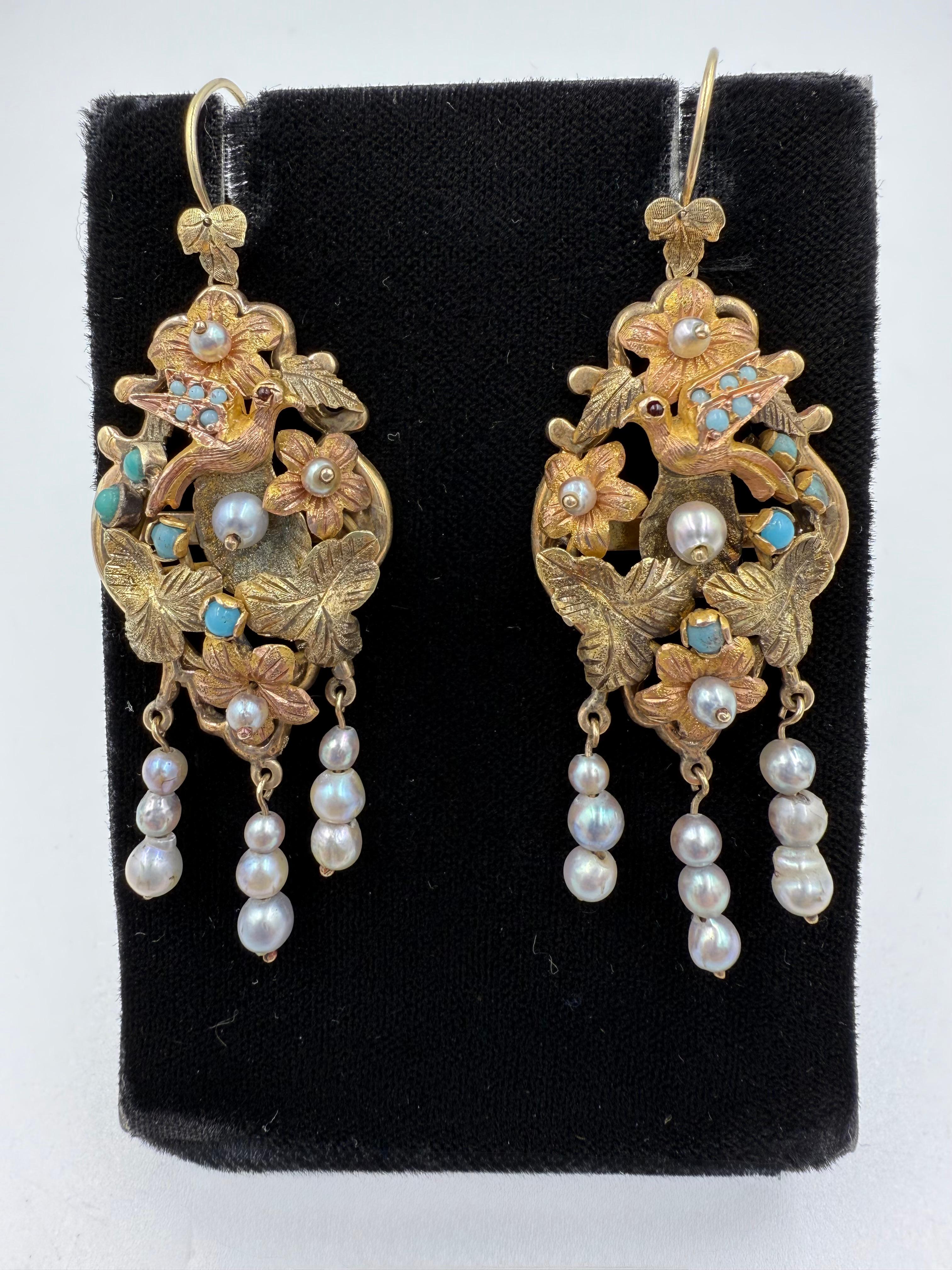 1880s Victorian Tri Color Gold Dangling Earrings.

These Victorian Tri-Color Gold Dangling Earrings were made in the 1880s.  The Victorian jewelers were pretty eclectic. Look how wonderfully these earrings were designed with a bird perched amongst