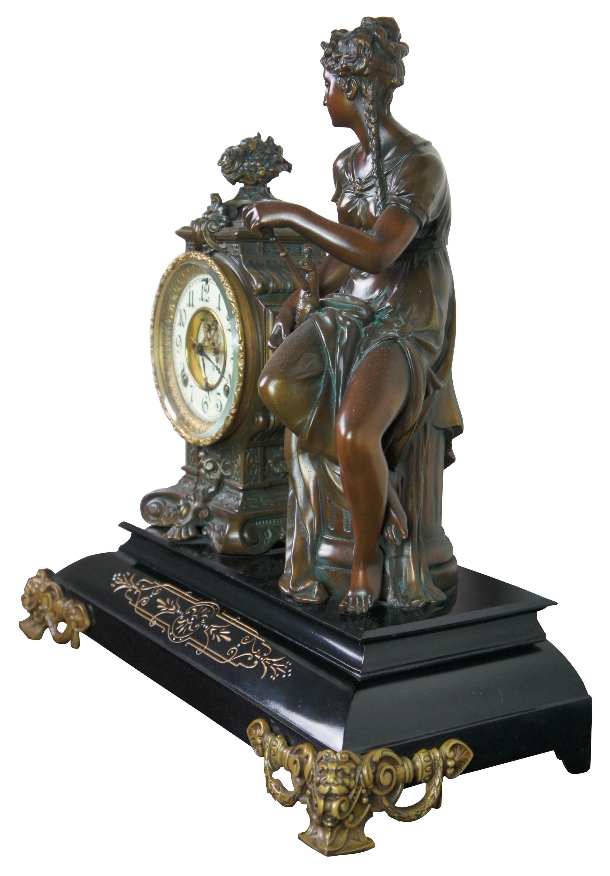 A rare and impressive Antique 1881 Ansonia open escapement mantel clock. Made of bronze and marble featuring neoclassical styling with a woman seated on a Corinthian column with her pet pheasant bird and gold footed base with half Northwind face
