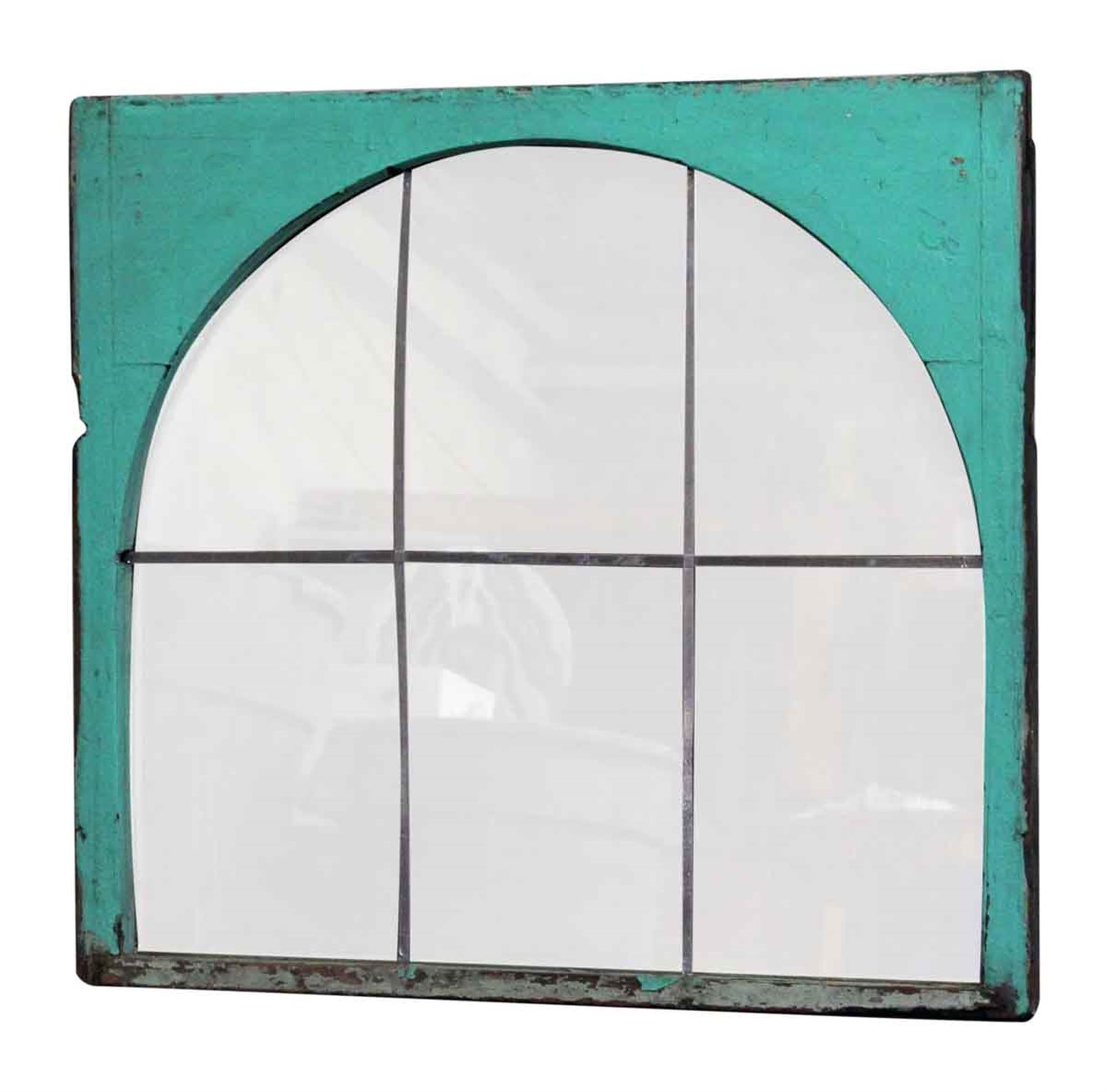 This unusual mirror was made with a wooden frame from the well known and loved Domino Sugar factory built in 1882 in Williamsburg, Brooklyn. The green paint is original and the glass has been hand silvered, making it a truly unique piece. This is