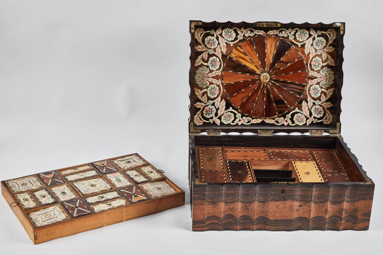 A gorgeous king ebony Inlaid Sri Lankan presentation box, circa 1880s with all pieces included. Created to showcase an artisan’s skill with various materials and techniques, much like a portfolio of work. Large in scale, with a lift-out tray and