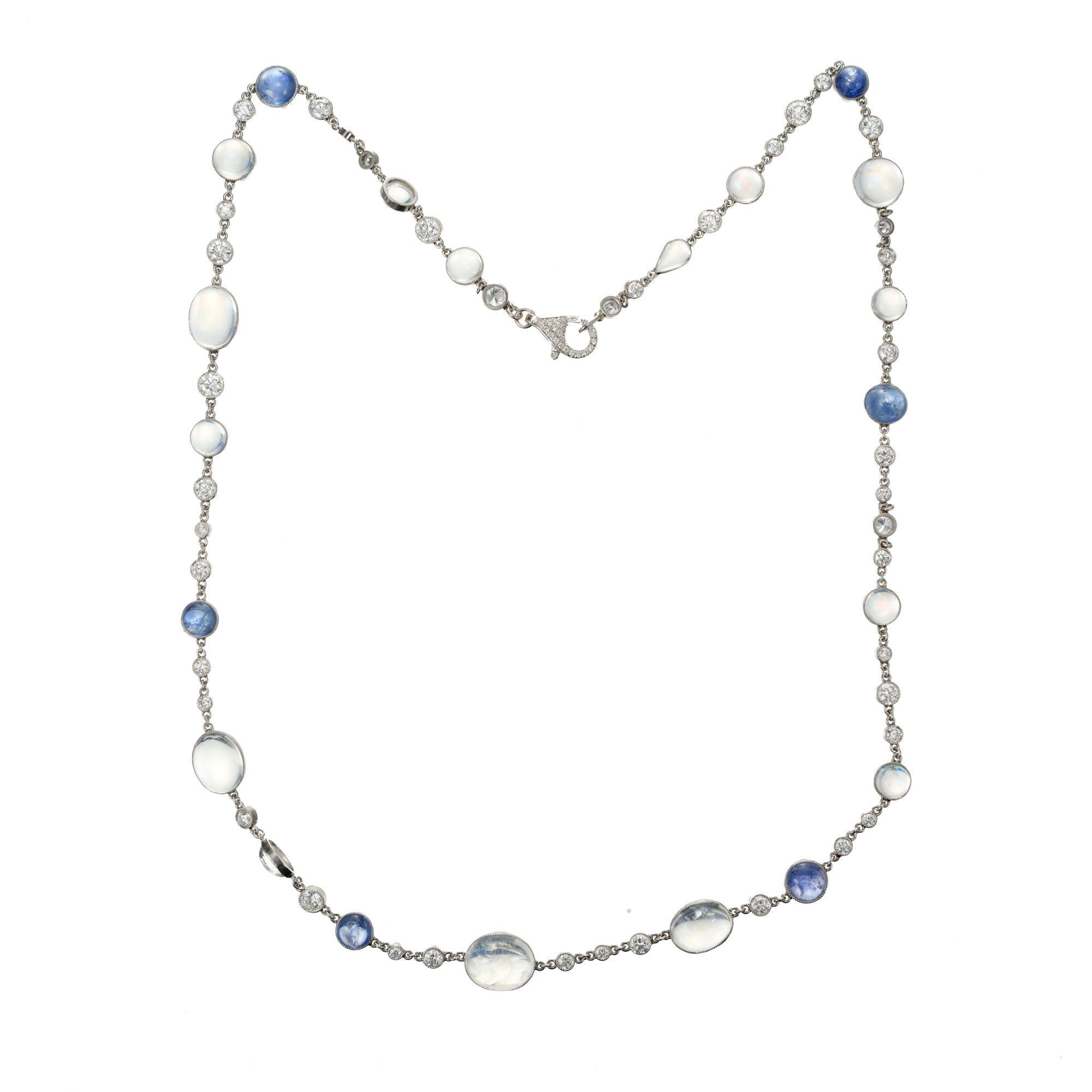 1970's Handmade moonstone and diamond necklace. 18 Inch necklace with bluish oval and round moonstones, natural cabochon round sapphires and round diamonds. 18 inch chain. 

4 rainbow bluish moonstone MI approx. 10.00cts
41 round brilliant cut