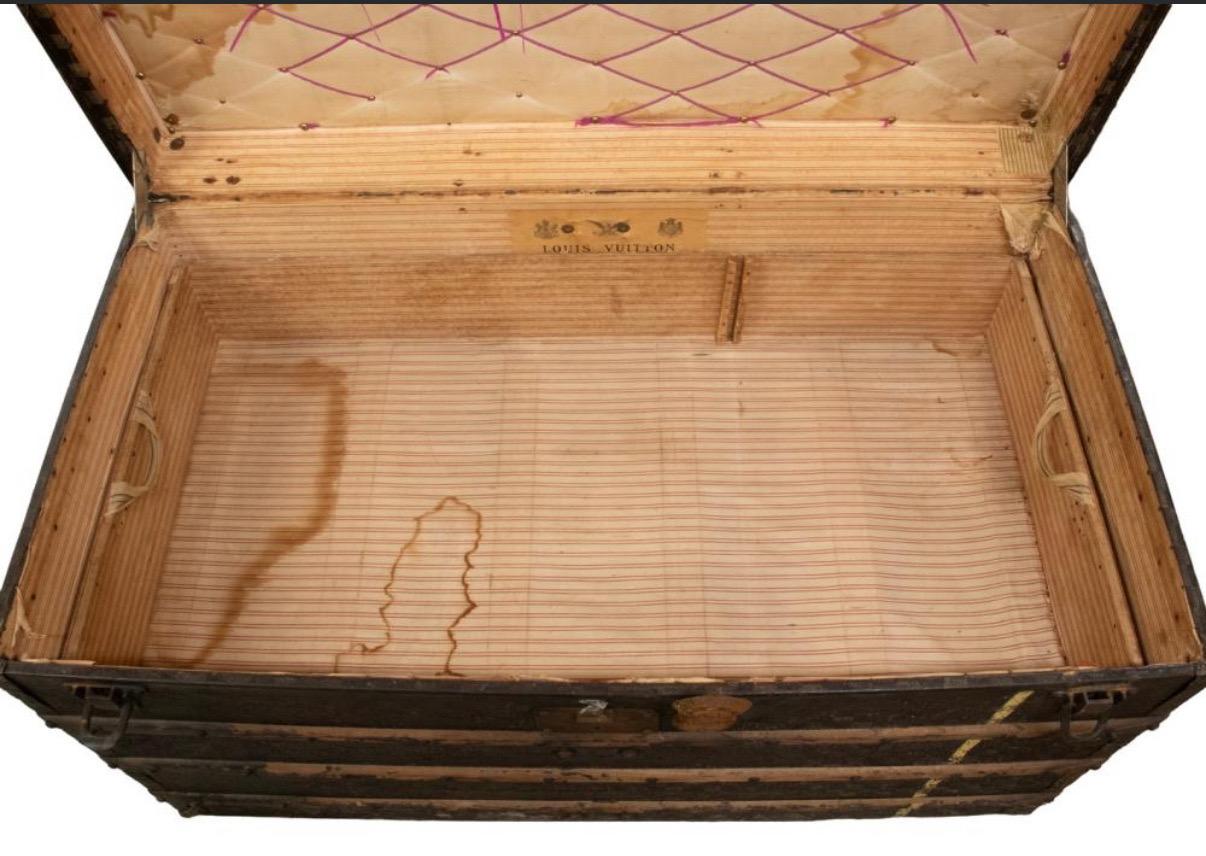 A late-Victorian, early Belle Époque Louis Vuitton steamer trunk — a true piece of luxury travel history.
Type: Steamer Trunk (flat-top travel trunk)
	-	Period: Circa 1898–1902
	-	Workshop: Louis Vuitton, Asnières (the Paris suburb where trunks were