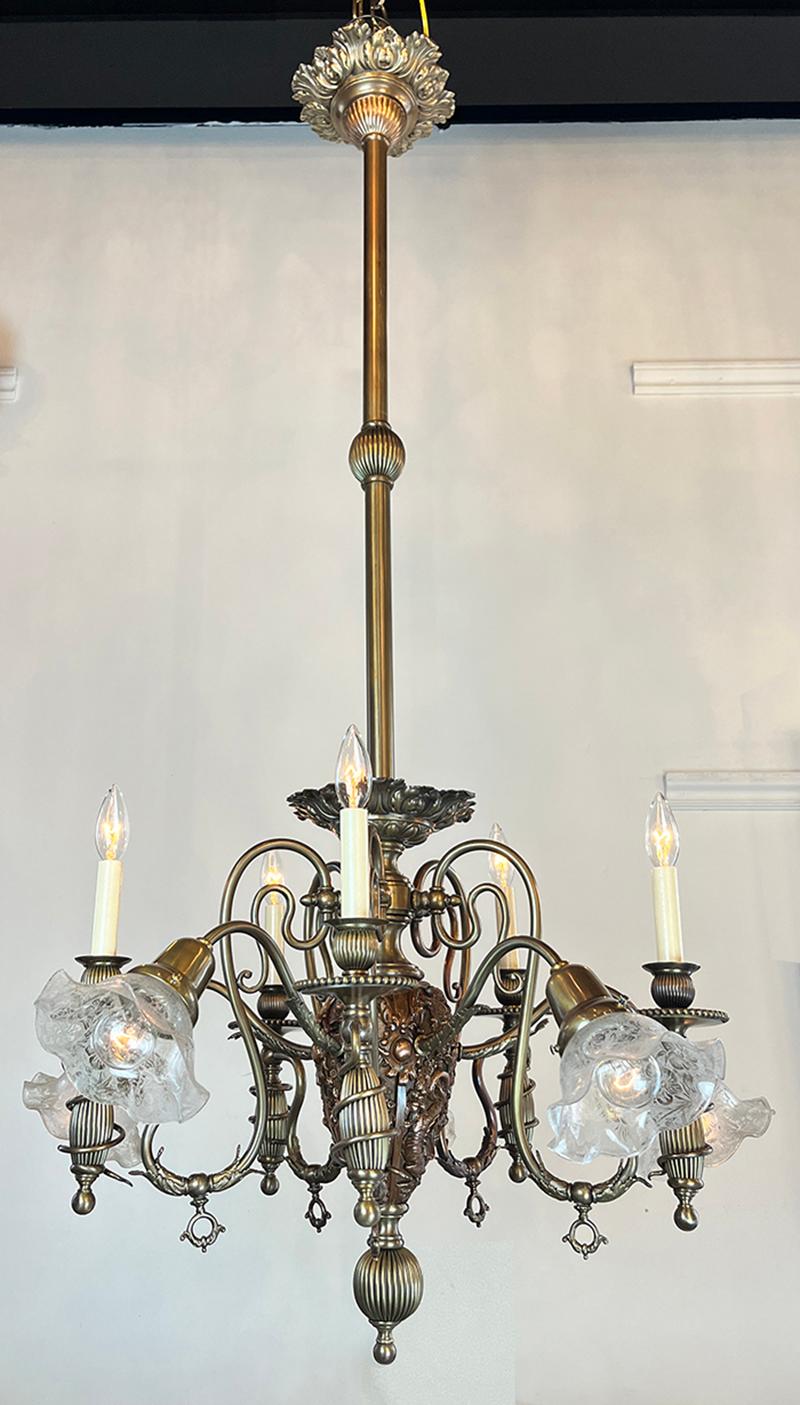Now this is a fascinating light and an incredible historic artifact from the very early days of electricity. It was originally a gas and electric light with the gas burners pointing up from the candles and the electric lights spreading outwards.