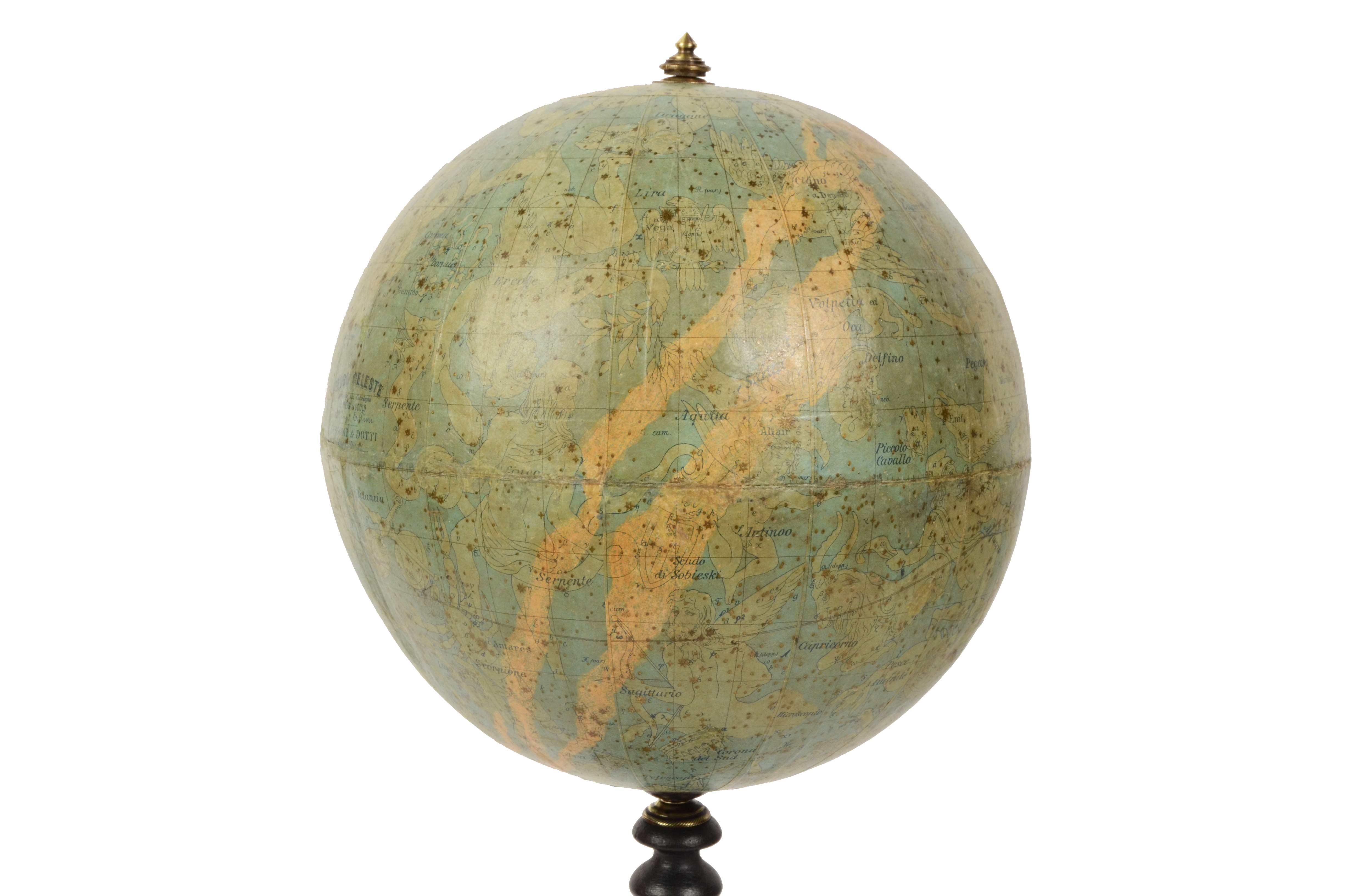Celestial globe compiled on the Hesi & Gould catalogs by Eng. Pini and published in 1889 by Gussoni & Dotti Milano piazza del Duomo. Sphere in paper mache covered with paper printed by engraving on copper plate and hand watercolored, base in turned