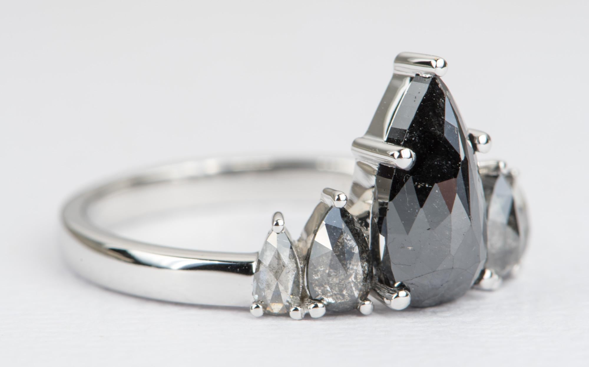 ♥  Solid 14K white gold ring set with a beautiful pear-shaped black salt and pepper diamond center, and complementary salt and pepper diamonds on each side to form a stunning mountain-range look

♥  US Size 7  (Free resizing)
♥  Band width: 2.3mm
♥ 