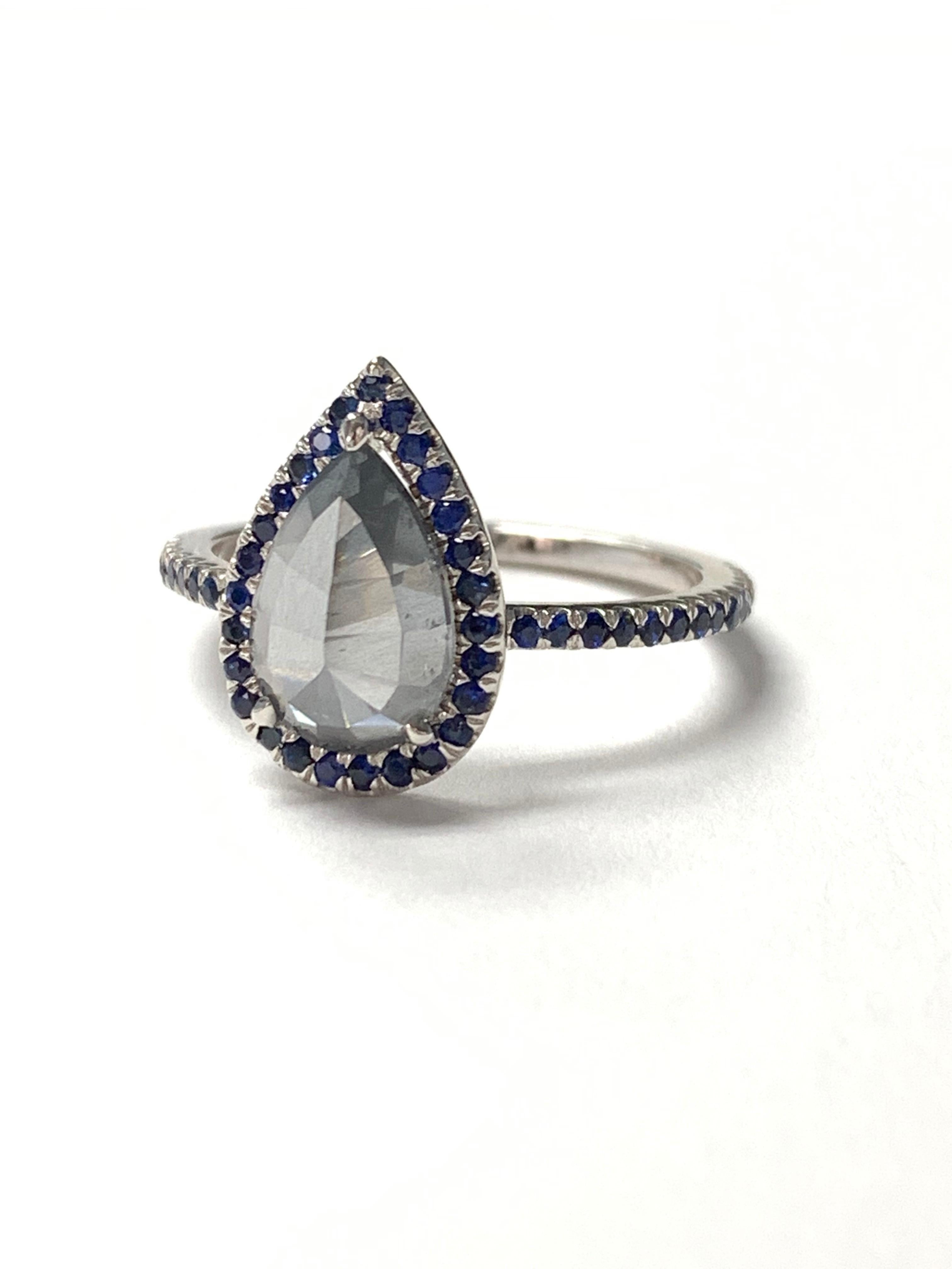 GIA Certified Fancy dark gray pear shape rose cut diamond and blue sapphire engagement ring hand crafted in 18 k gold. 
The details are as follows : 
Fancy dark gray pear shape rose cut diamond weight : 1.89 carat 
Blue sapphire weight : 0.55 carat