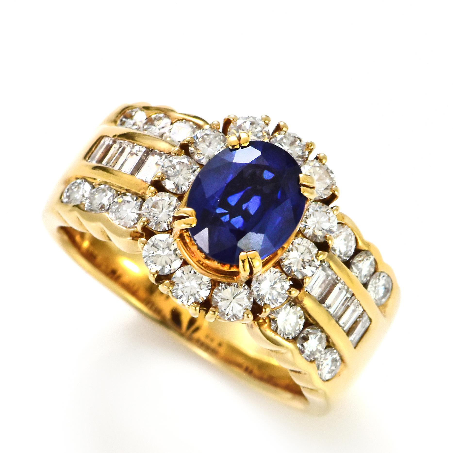 A beautiful ring featuring a 1.89 Carat Natural Sapphire and 1.68 Carats Diamond Accents set in 18 Karat Gold. Sapphires have extraordinary durability - they excel in hardness as well as toughness and durability making them very popular in jewelry.