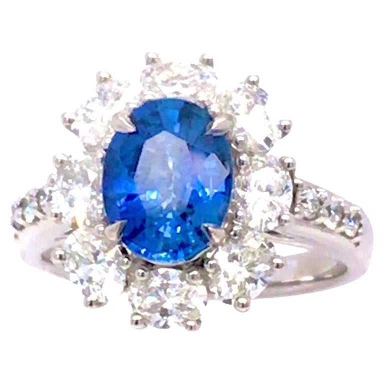 1.89 Carat Oval Cut Ceylon Sapphire Ring with 1.53 Carat Diamond Halo in 18k For Sale