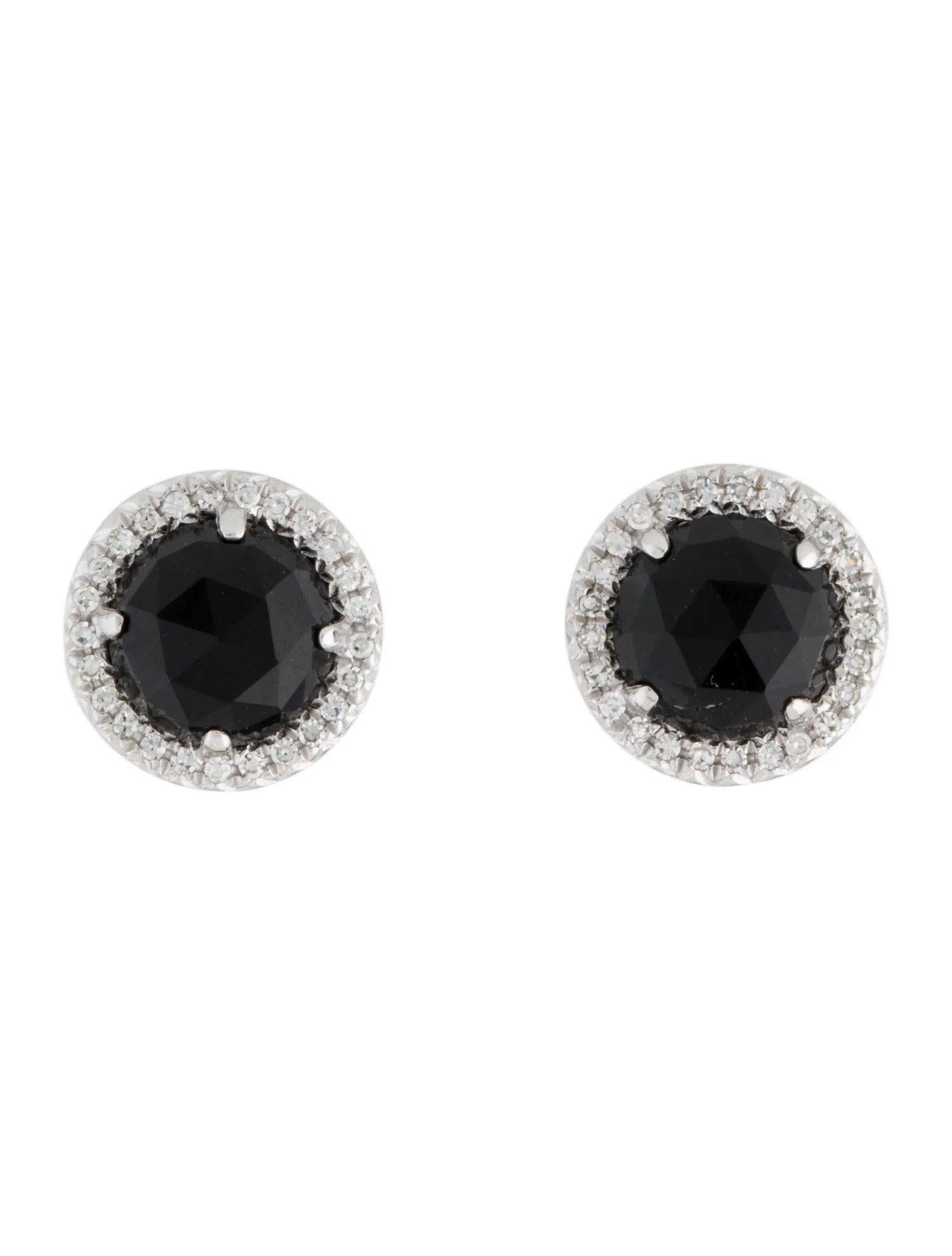 These Black Onyx & Diamond Earrings are a stunning and timeless accessory that can add a touch of glamour and sophistication to any outfit. 

These earrings each feature a 0.94 Carat Round Black Onyx , with a Diamond Halo comprised of 0.06 Carats of