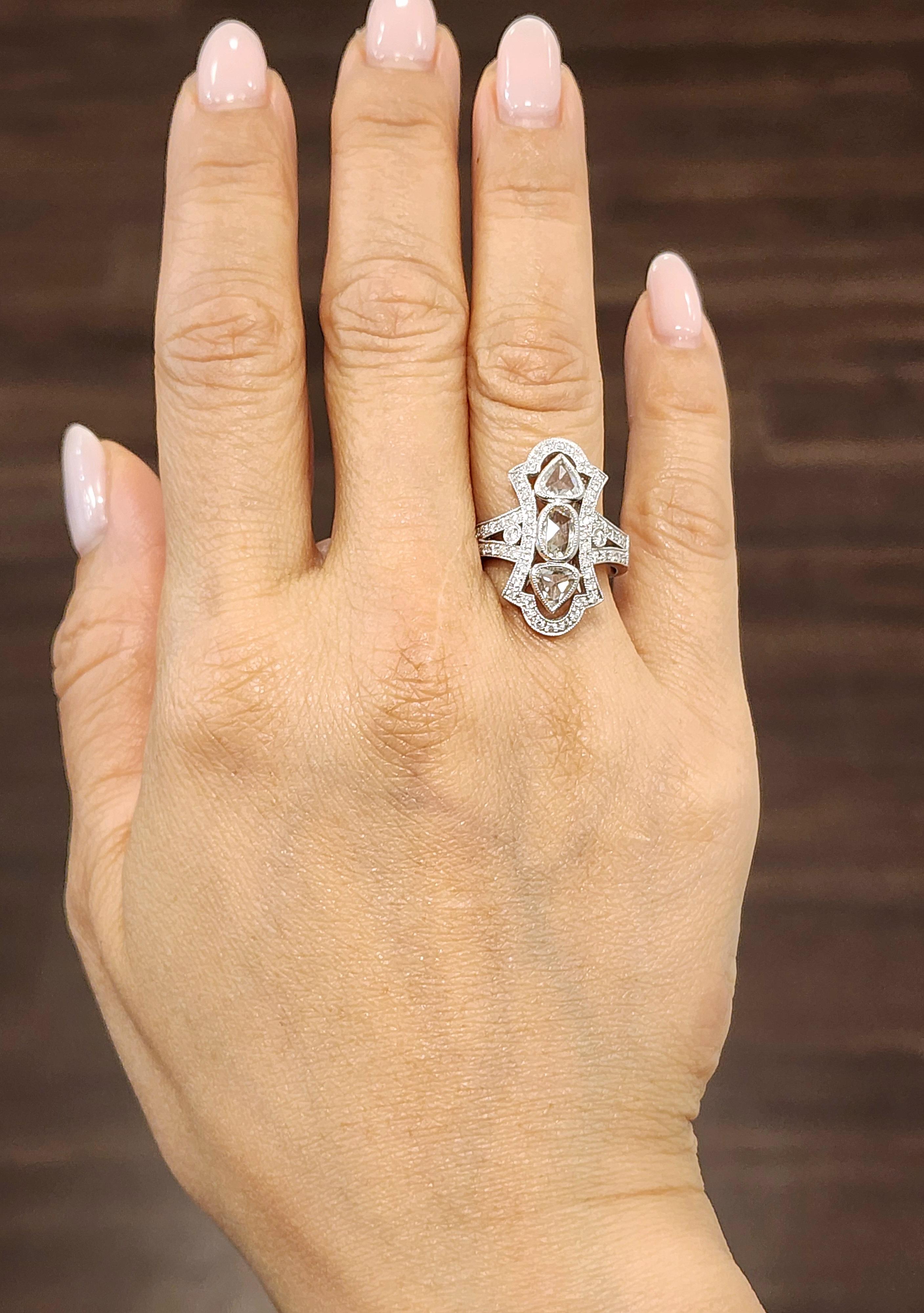 Add a touch of elegance to your jewelry collection with this stunning 1.89 ct diamond ring. Crafted from 18k white gold, this ring features beautiful rose cut diamond with VS2/SI1 clarity grade and H/I color grade. The ring is sizable and comes in a