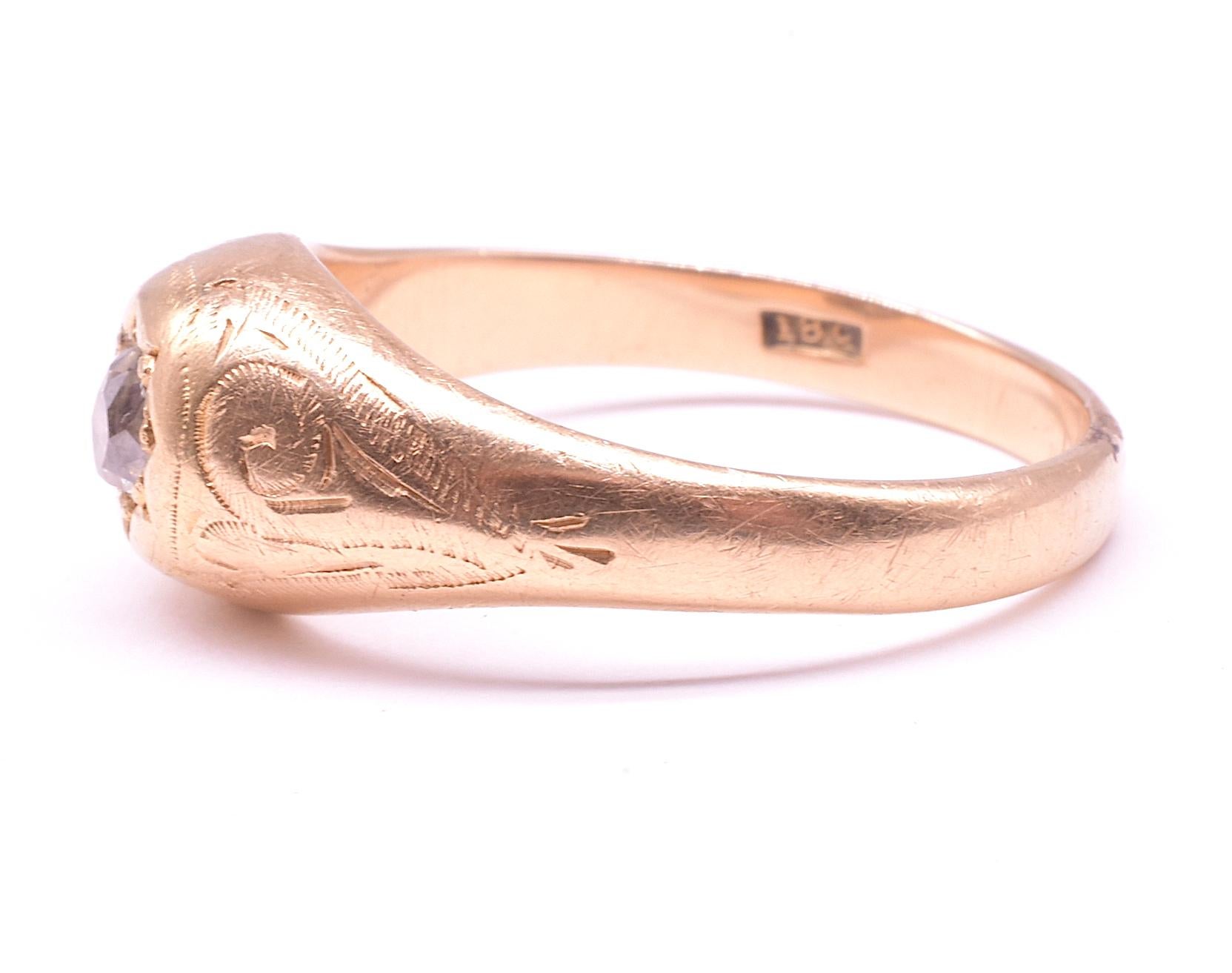 Charming 18K Victorian flush mount ring with a solitaire diamond set in an unusual carved pointed petal setting with incised flourishes along the shoulders which are a nice detail. This type of mounting was popular through the 19th century and into