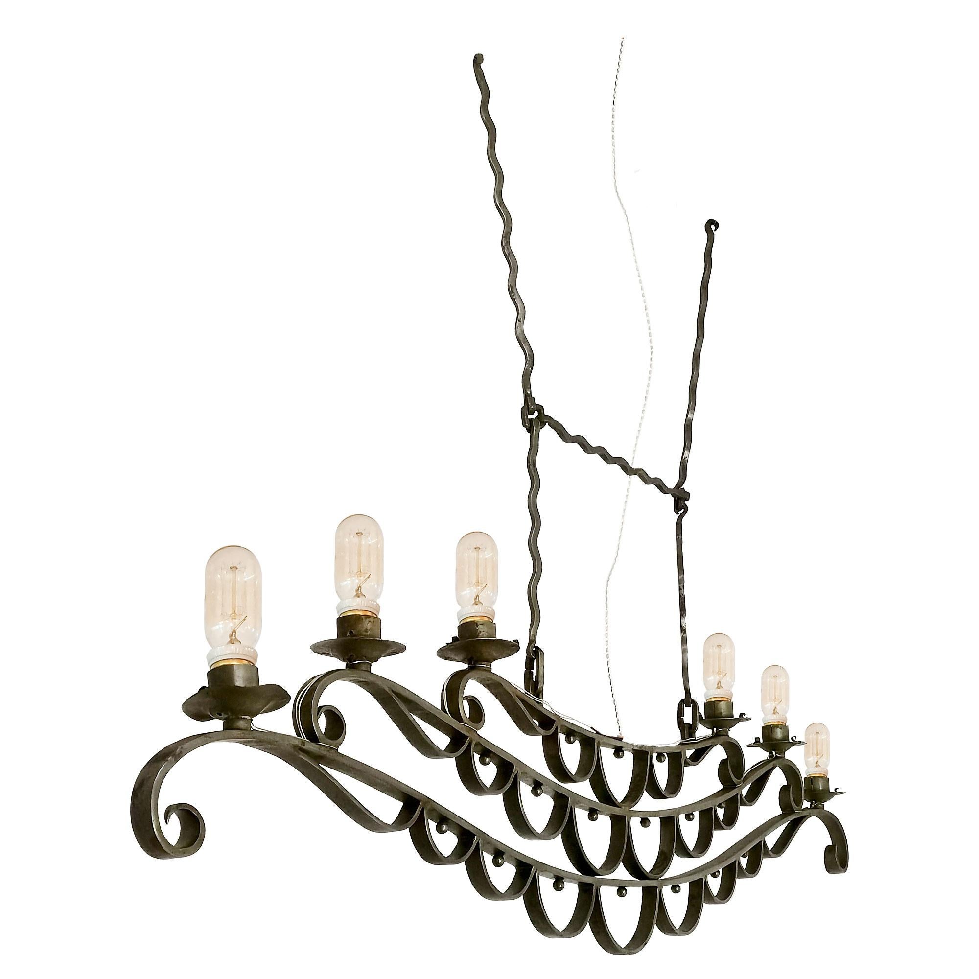 Large ceiling light in wrought iron, originally made as oil lamp, later electrified. Completely restored, metal polished and new wiring.

France, 1890-1900.