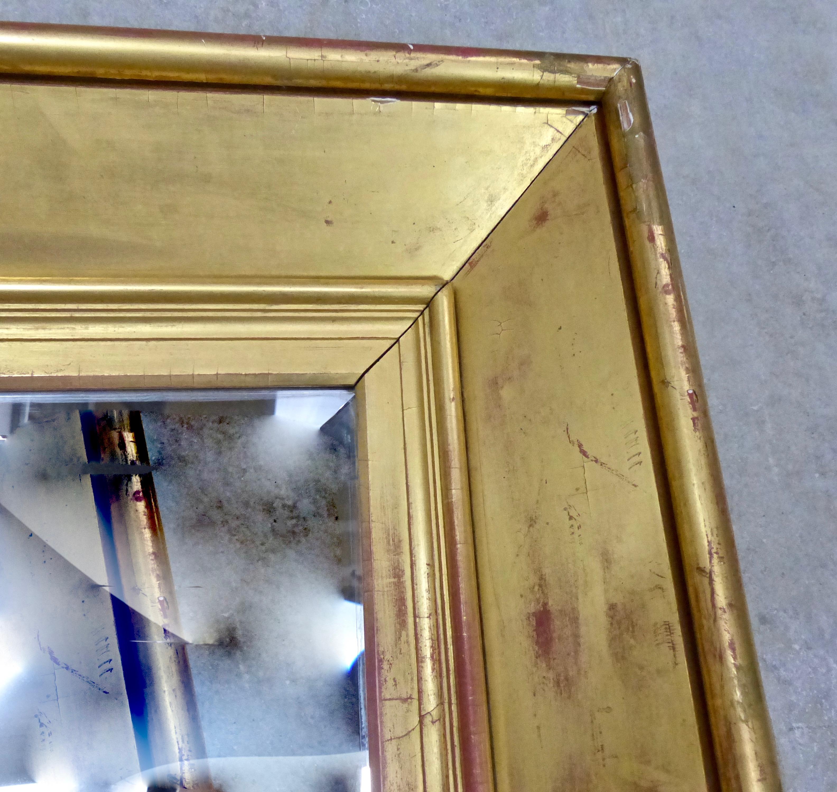 Elegantly simple, near-square gold-leaf mirror with wide, deep wooden frame and original bevelled mirror. Goes anywhere, and with anything.
Dimensions: 44