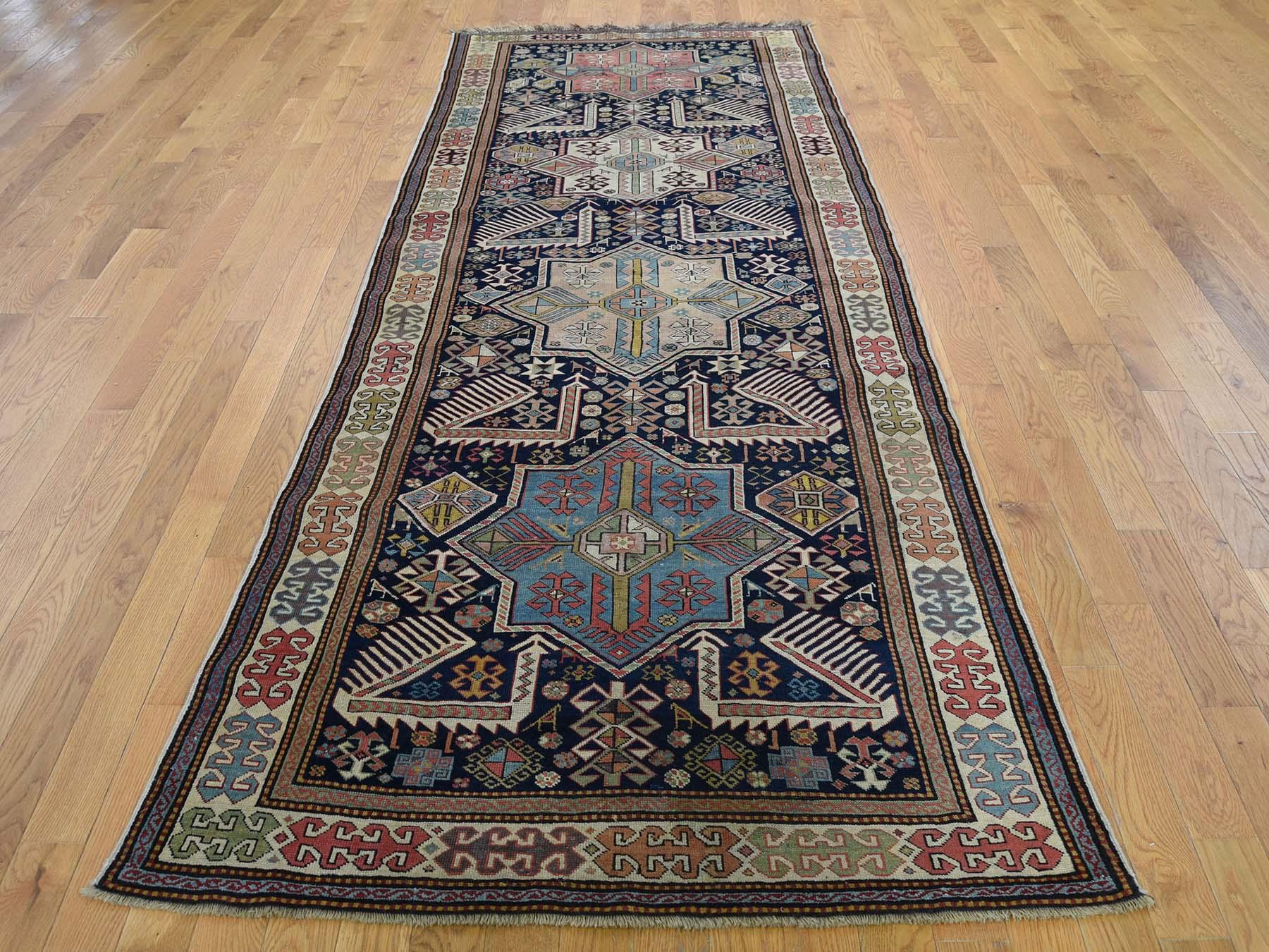 This is a genuine hand knotted oriental rug. It is not hand tufted or machine made rug. Our entire inventory is made of either hand knotted or handwoven rugs.

Bring life to your home with this lovely hand knotted Blue Akstafa Design, is an original
