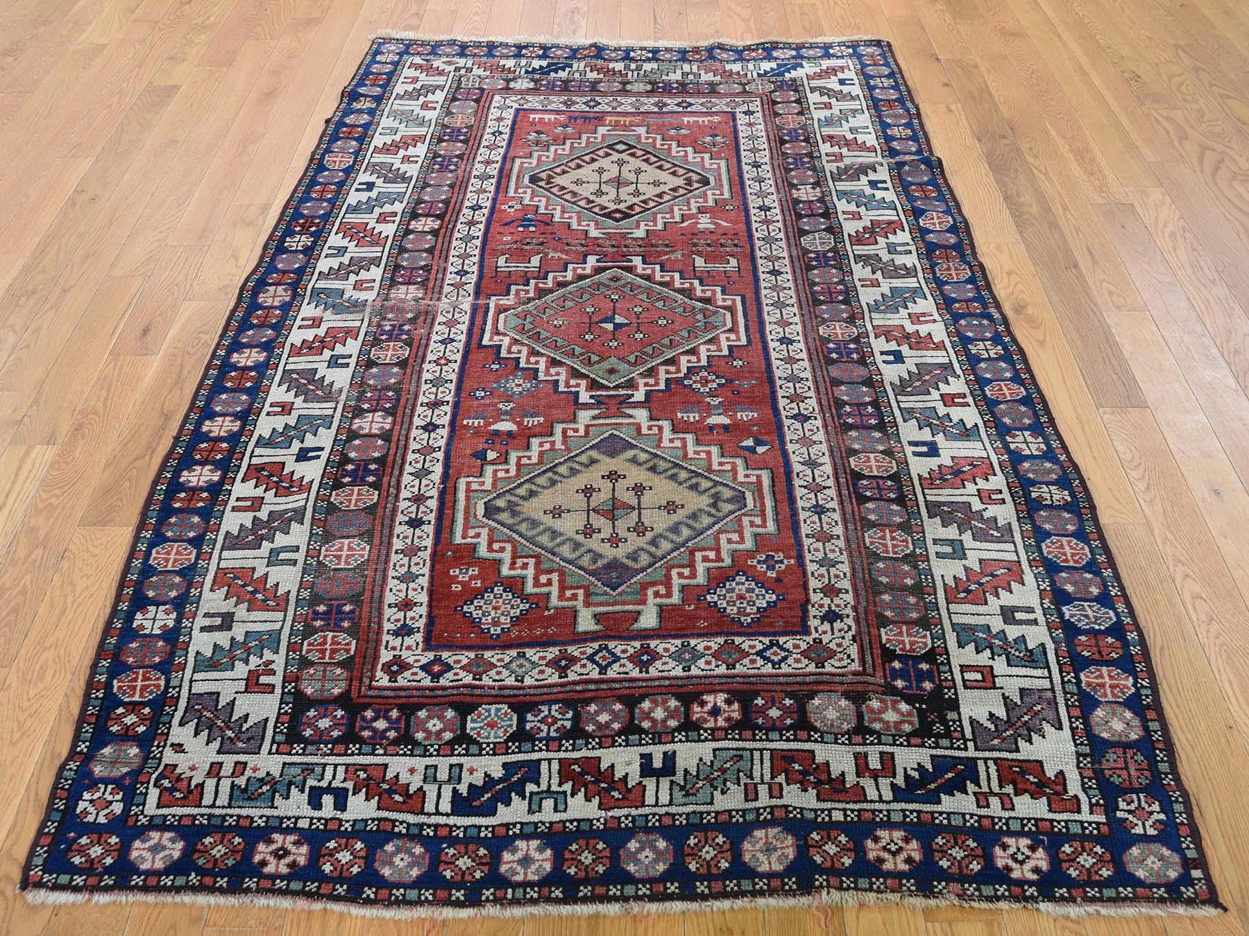 Description: This is a genuine hand knotted oriental rug. It is not and tufted or machine made rug. Our entire inventory is made of either hand knotted or handwoven rugs.

Enhance your room style with this marvelous hand knotted red antique