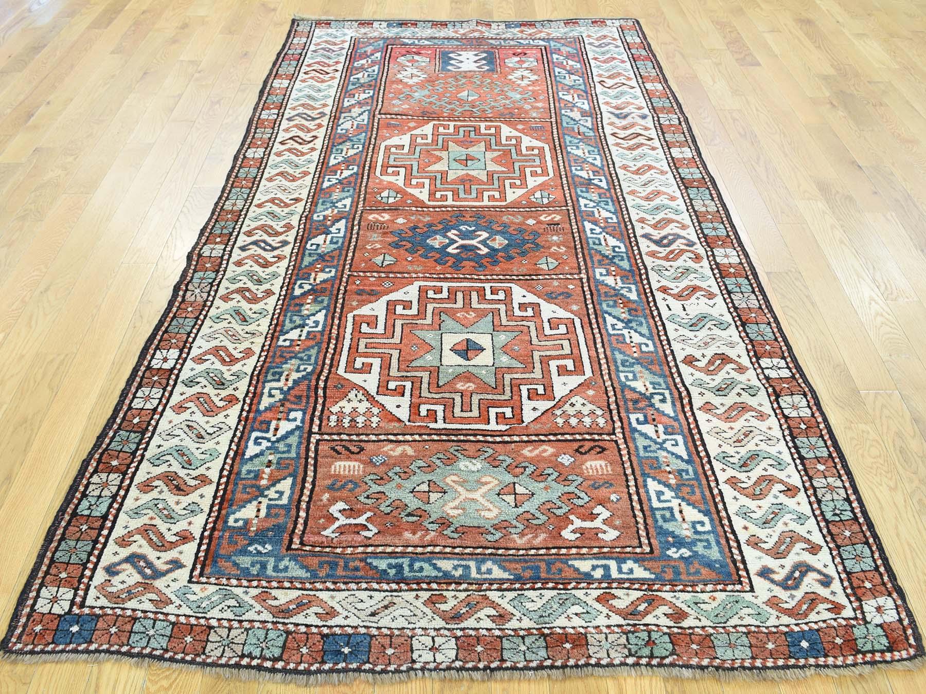 This is a genuine hand knotted Oriental rug. It is not hand tufted or machine made rug. Our entire inventory is made of either hand knotted or handwoven rugs.

Enhance your home with this magnificent antique carpet. This handcrafted Caucasian